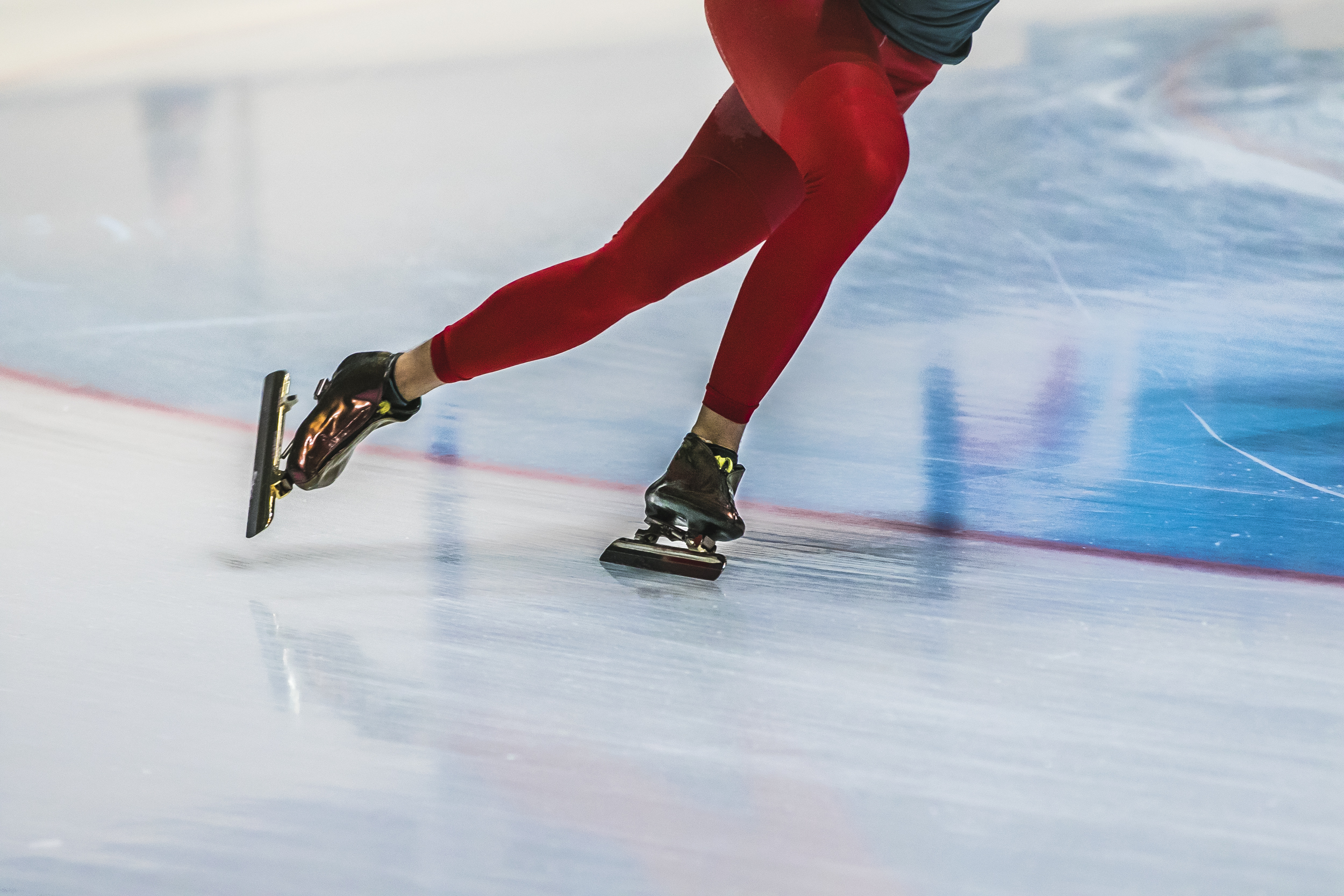 closeup feet girl skater riding on ice