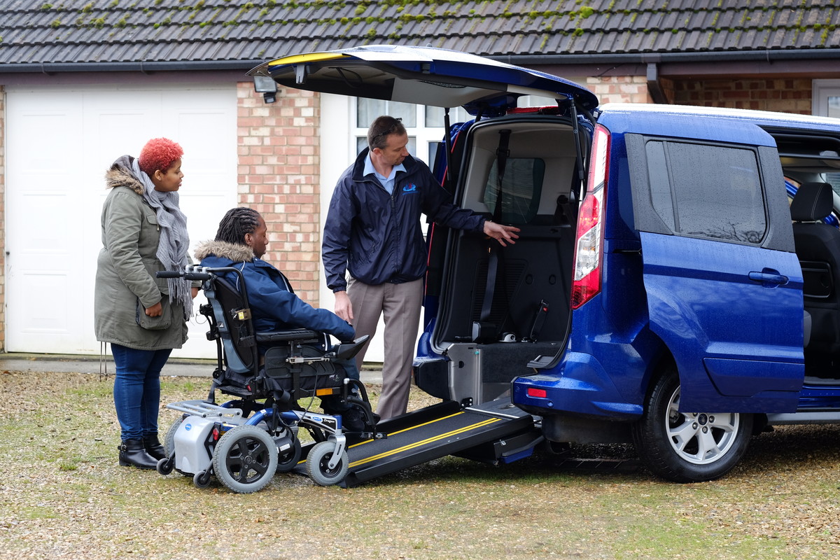 Powered wheelchair user driving into WAV