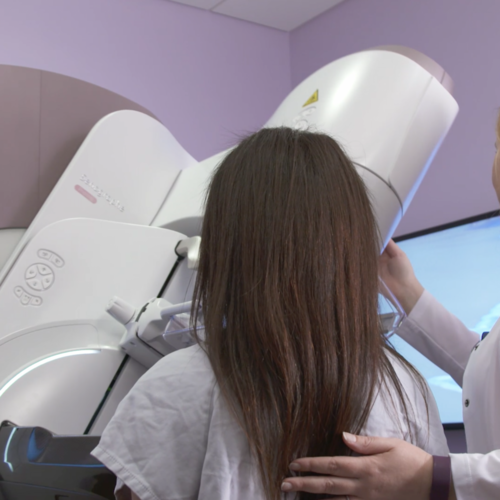 Patient and female technician using new GE Healthcare Pristina Dueta mammography imaging system