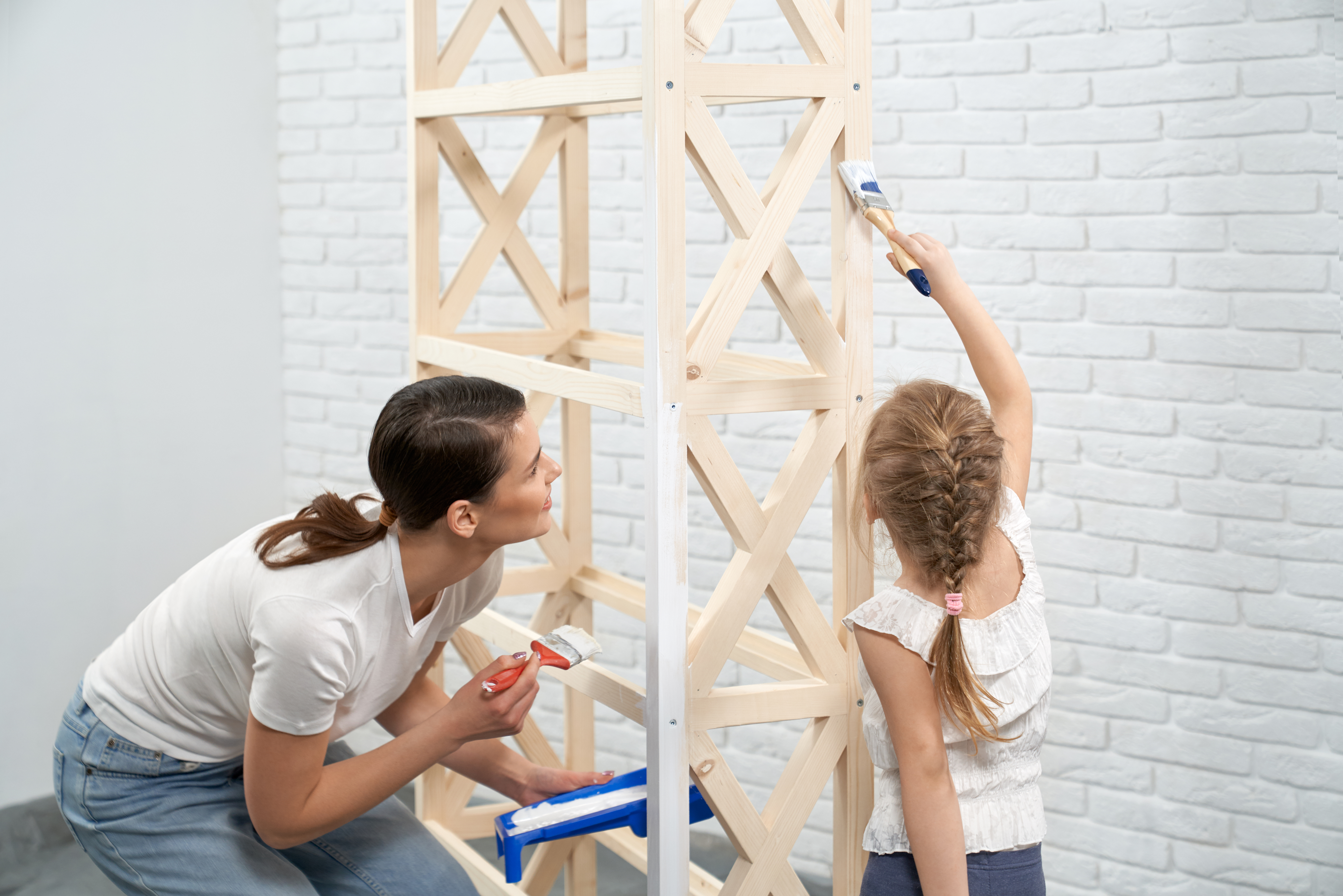 young-mother-child-painting-wooden-rack.jpg