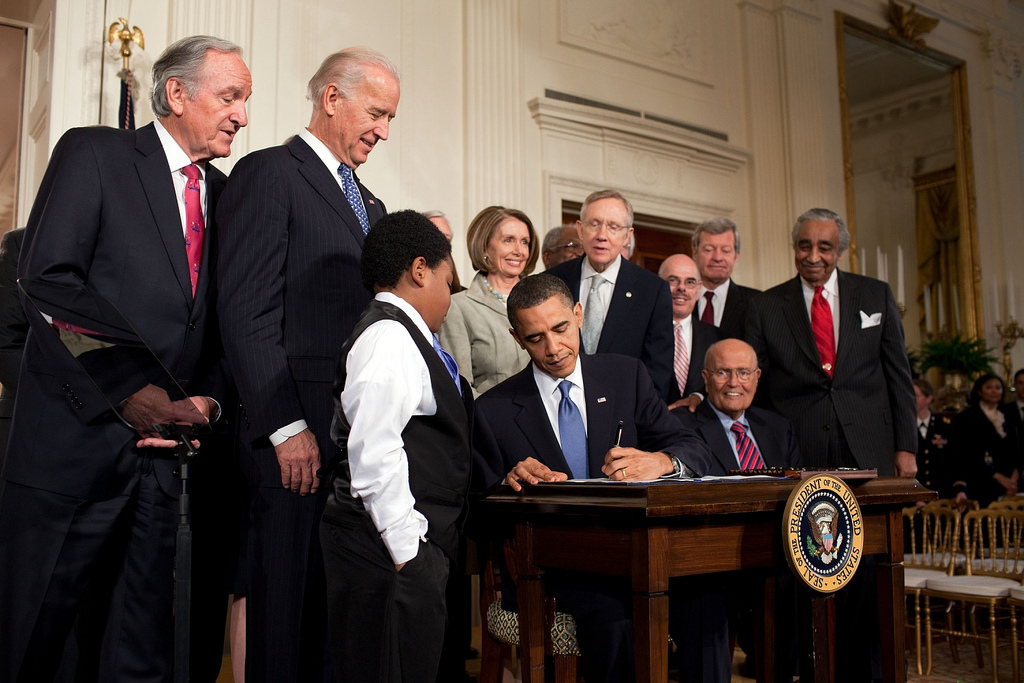 President Obama signing the Affordable Care Act into law on March 23, 2010
