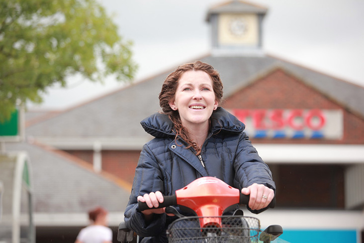 Motability Scheme customer driving scooter