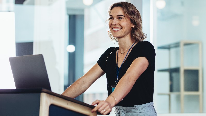Businesswoman standing at podium