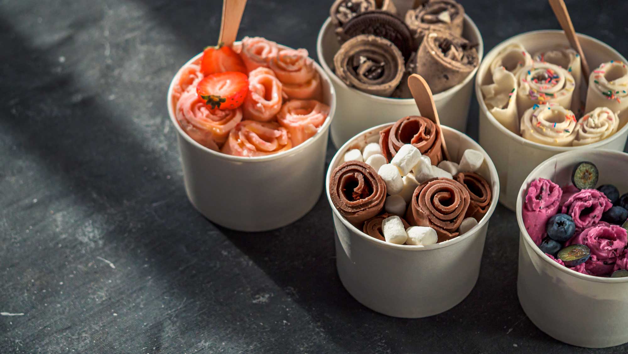 Making rolled ice cream, a Thai street food 