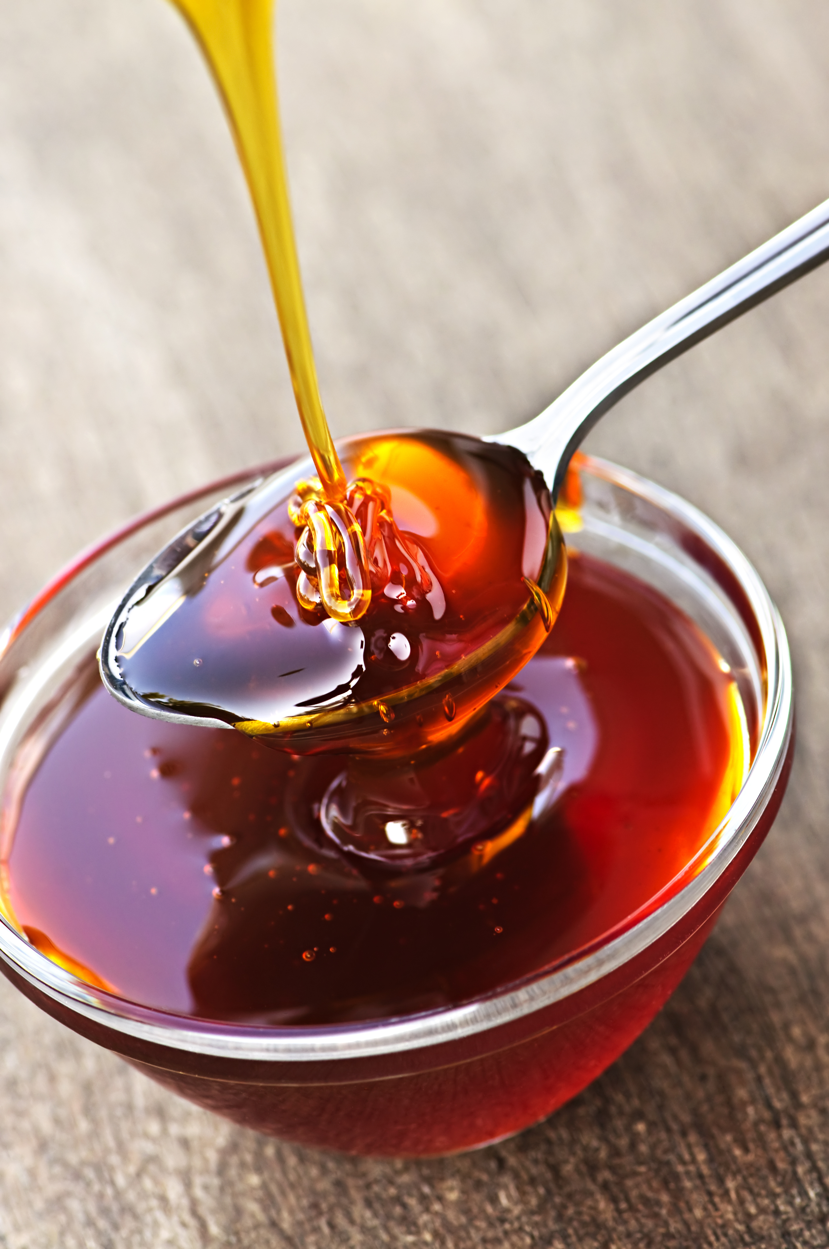 Honey dripping onto spoon