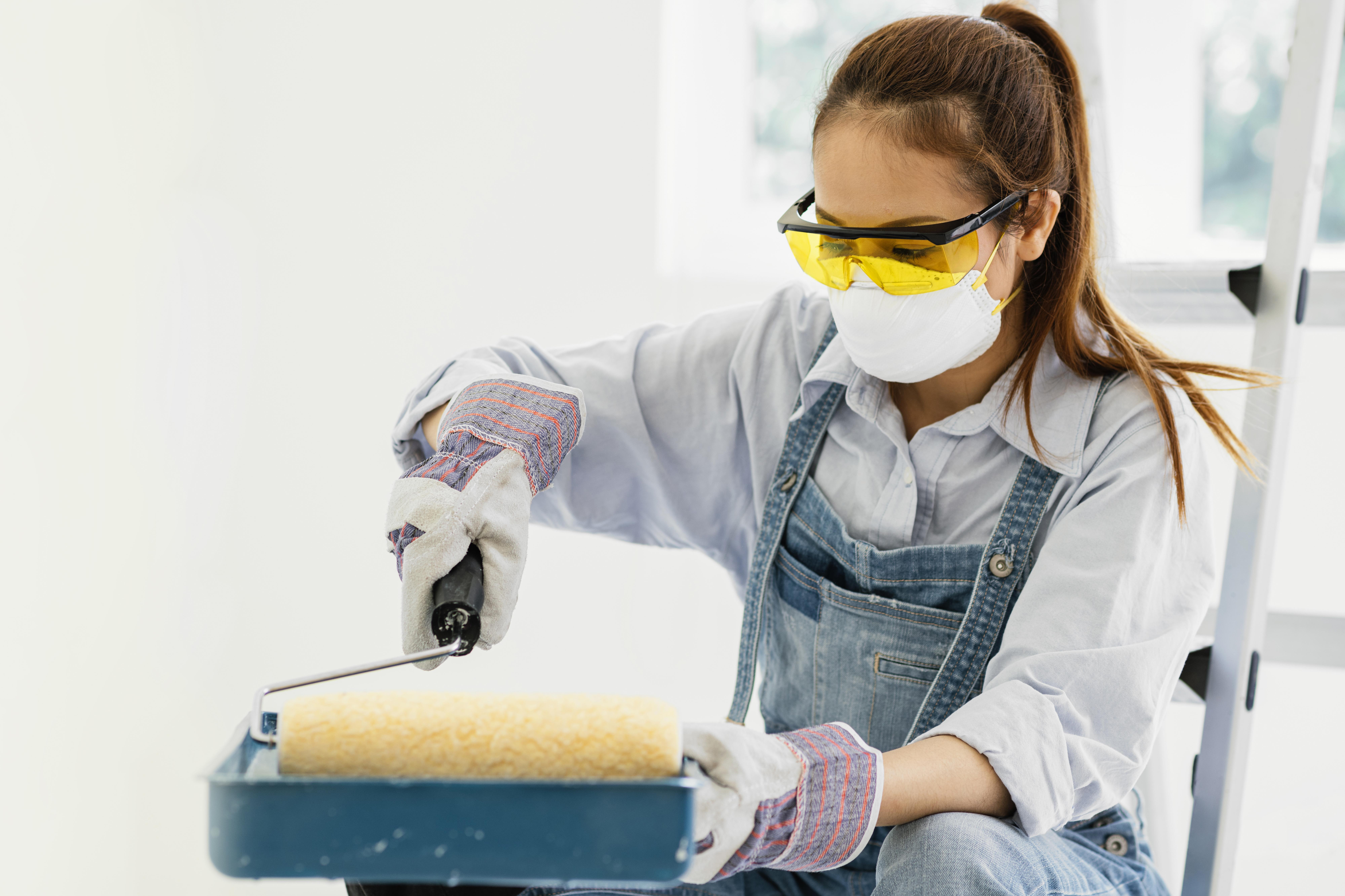 woman-with-safety-protection-equipment-painting.jpg