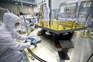 NASA engineers test mirror components of the agency's Webb Telescope.