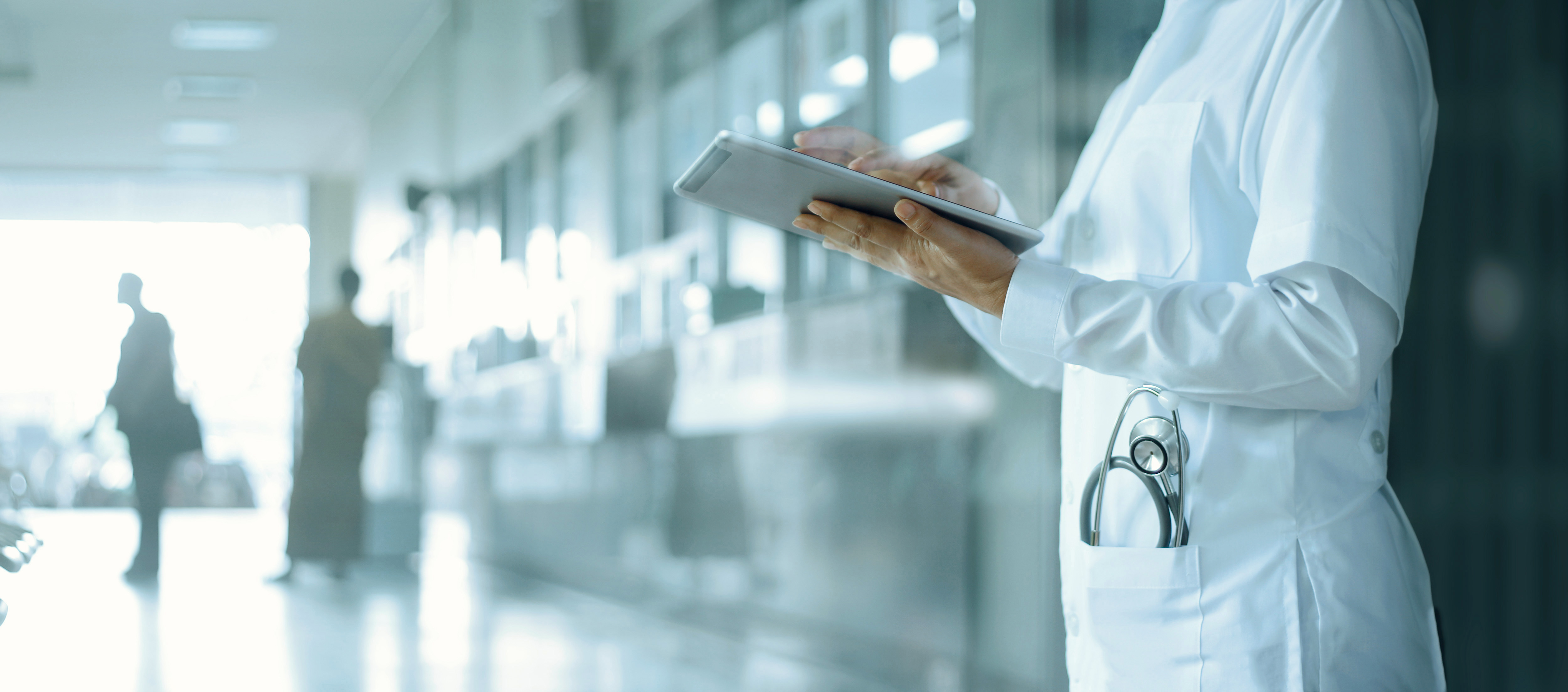 Healthcare and medicine. Medical and technology. Doctor working on digital tablet on hospital background