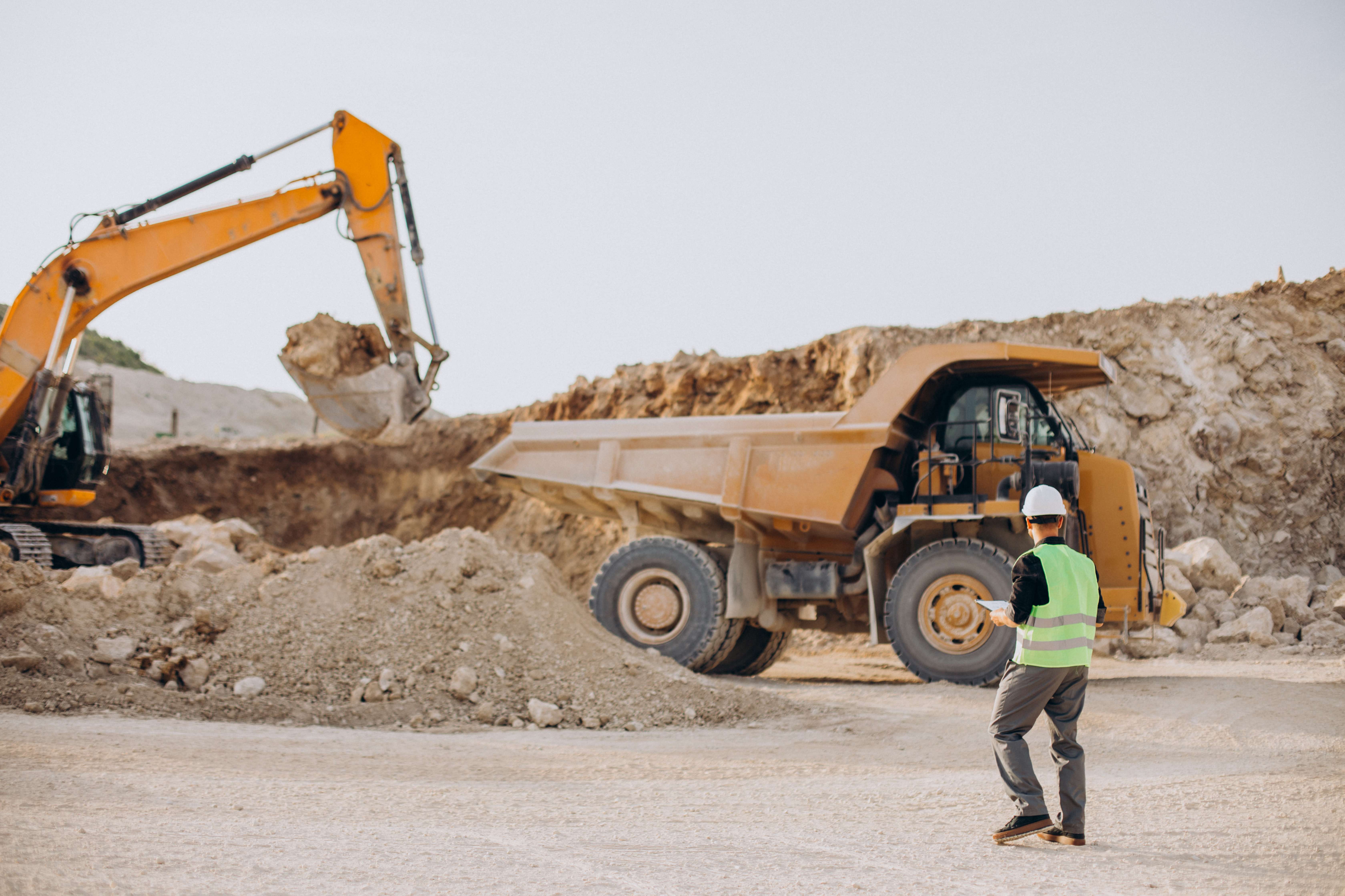 male-worker-with-bulldozer-sand-quarry (1).jpg