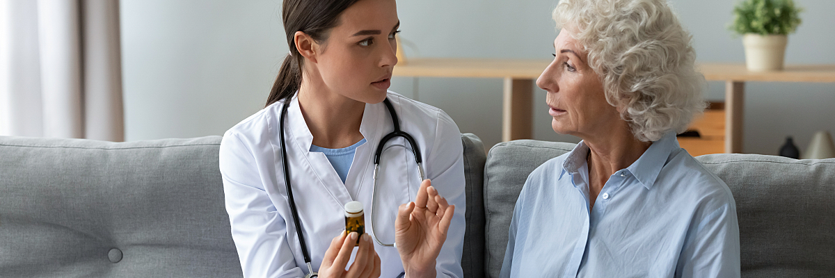 A cardiologist discusses medication with a patient. 