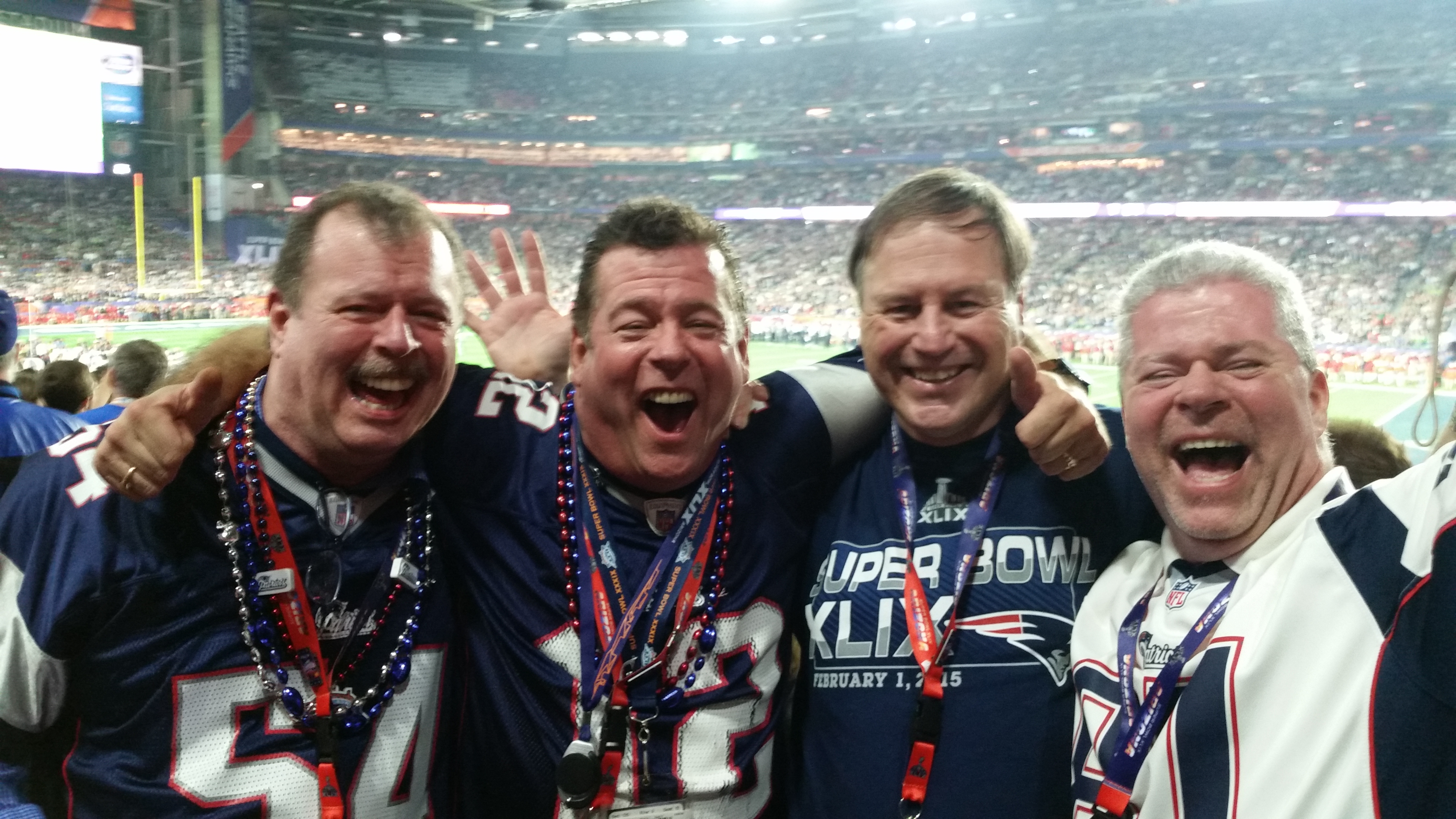Super-fan Kelly, left, with two brothers and a friend at Super Bowl XLIX, 30 seconds after the Patriots' victory.
