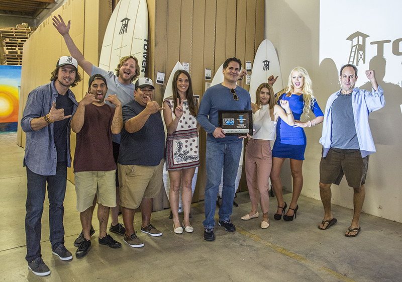 Aarstol, far right, with Mark Cuban and Tower Paddleboards' workforce