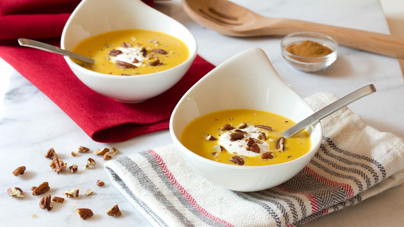 https://images-cdn.welcomesoftware.com/Zz0wYmUxN2JmNTE2YjcxNzk3M2FhYzM4NzlmMDgxYzg3Mg==/creamy-butternut-squash-soup-with-toasted-pecans-a-spicy-perspective.jpg?width=1366