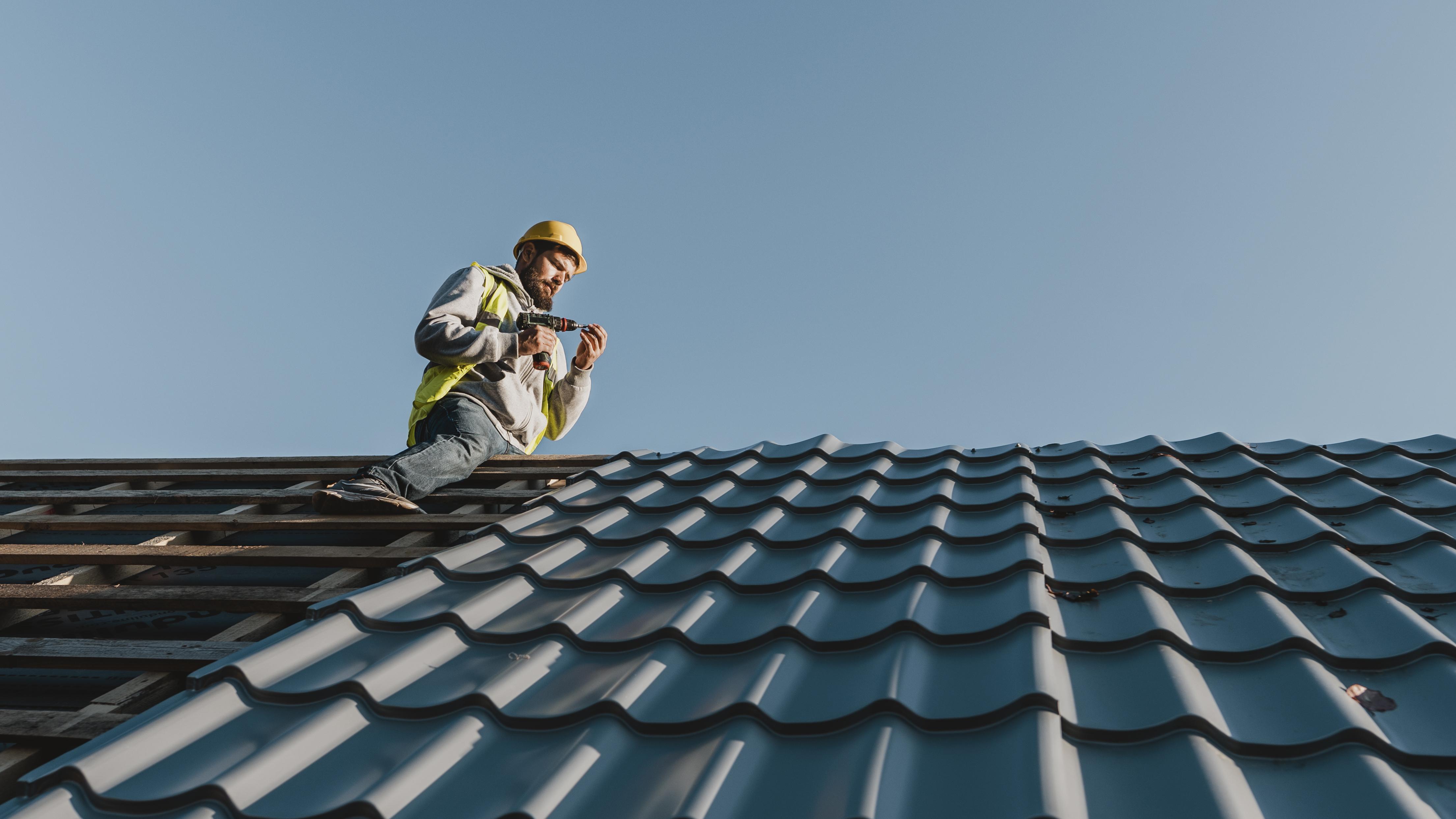 long-shot-man-working-roof.jpg