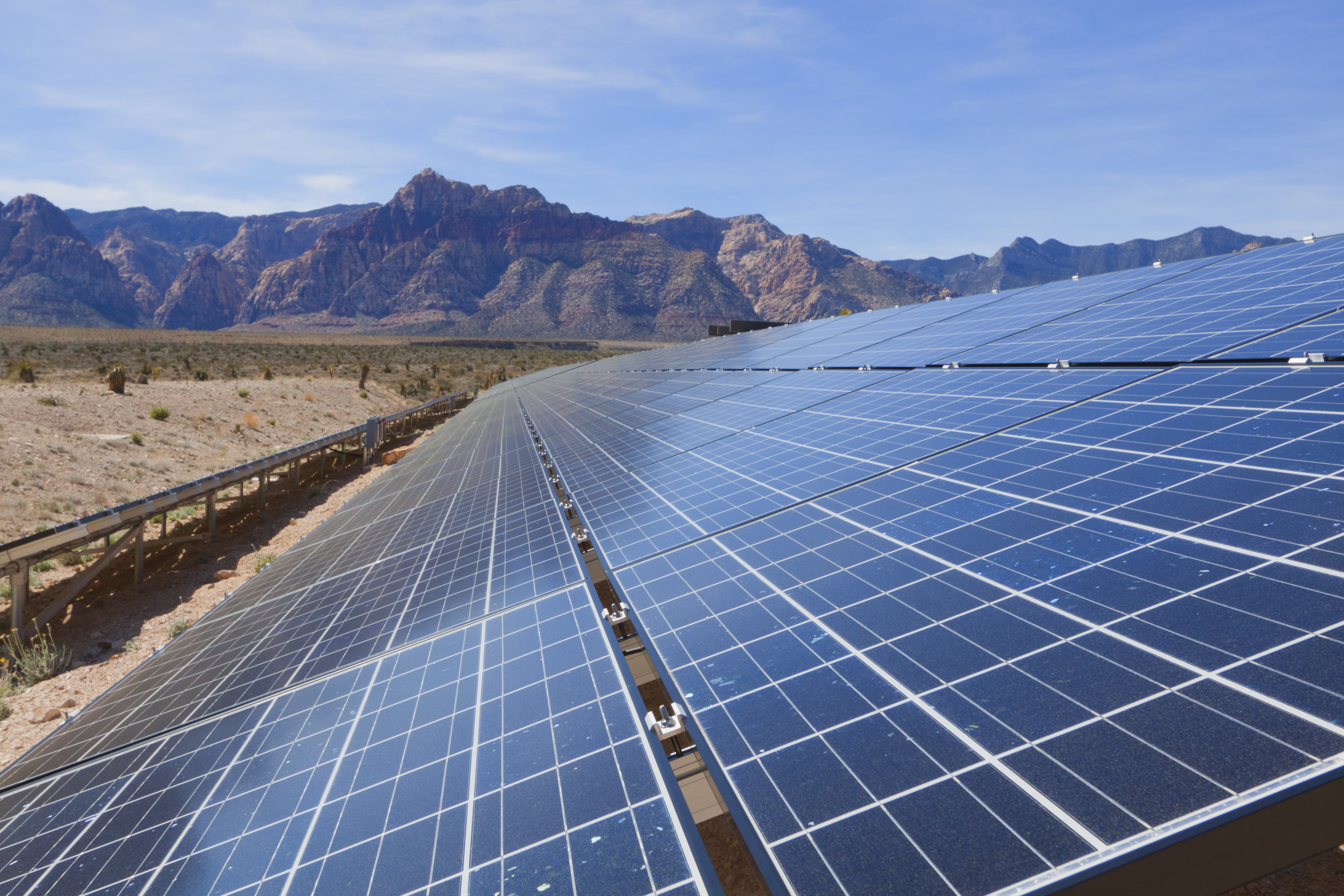 Tilted solar panels, near the mountains of the Mojave Desert