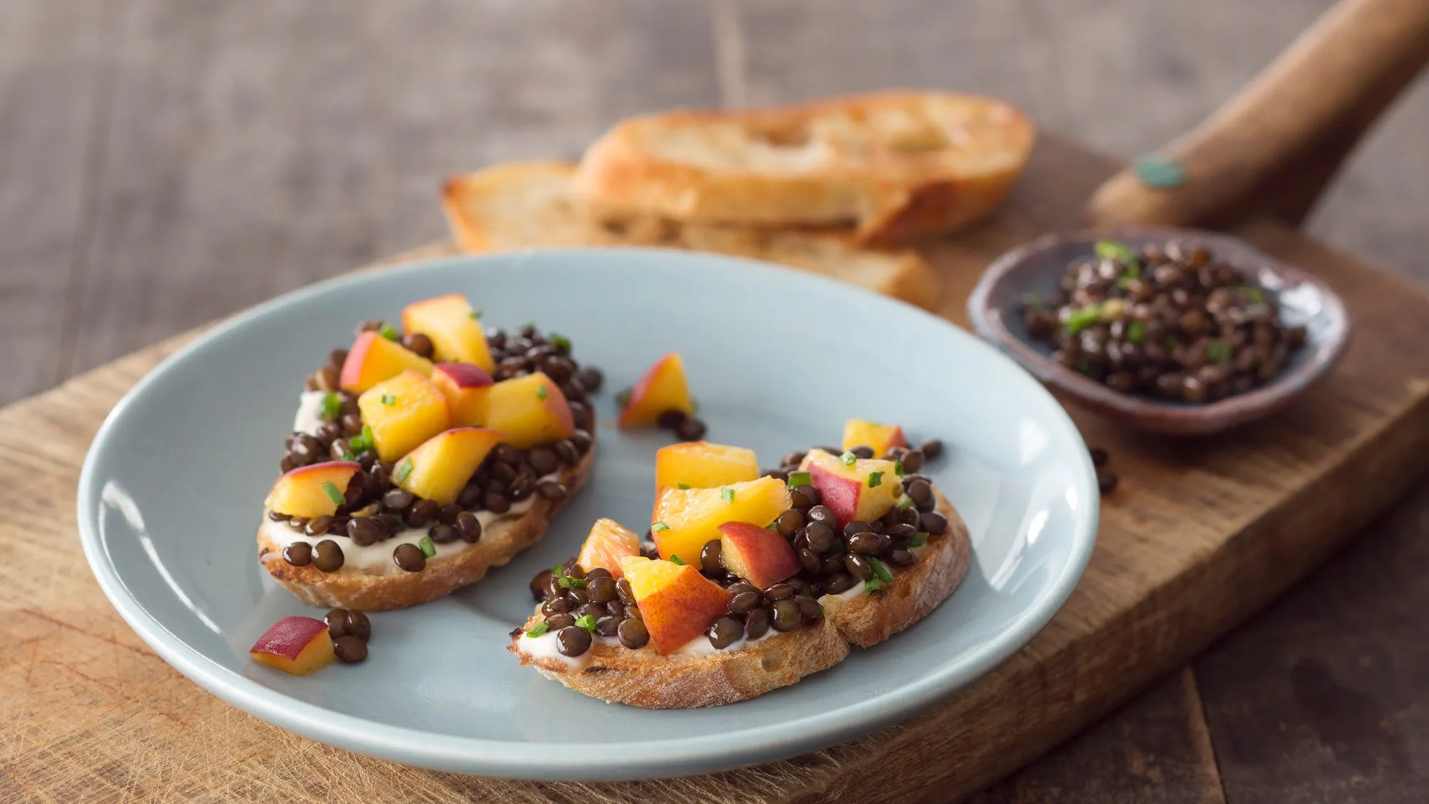 pickled-peach-and-black-beluga-lentil-toasts.webp