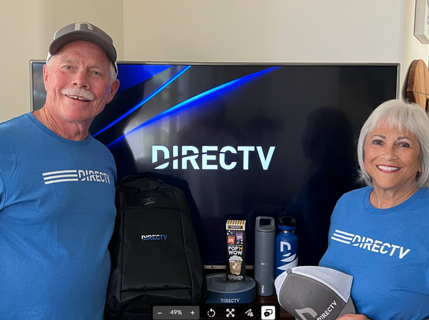 alt="A person and person standing in front of a televisionDescription automatically generated"