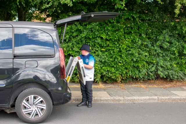 Sarah's nephew helping her with her Wheelchair Accessible Vehicle