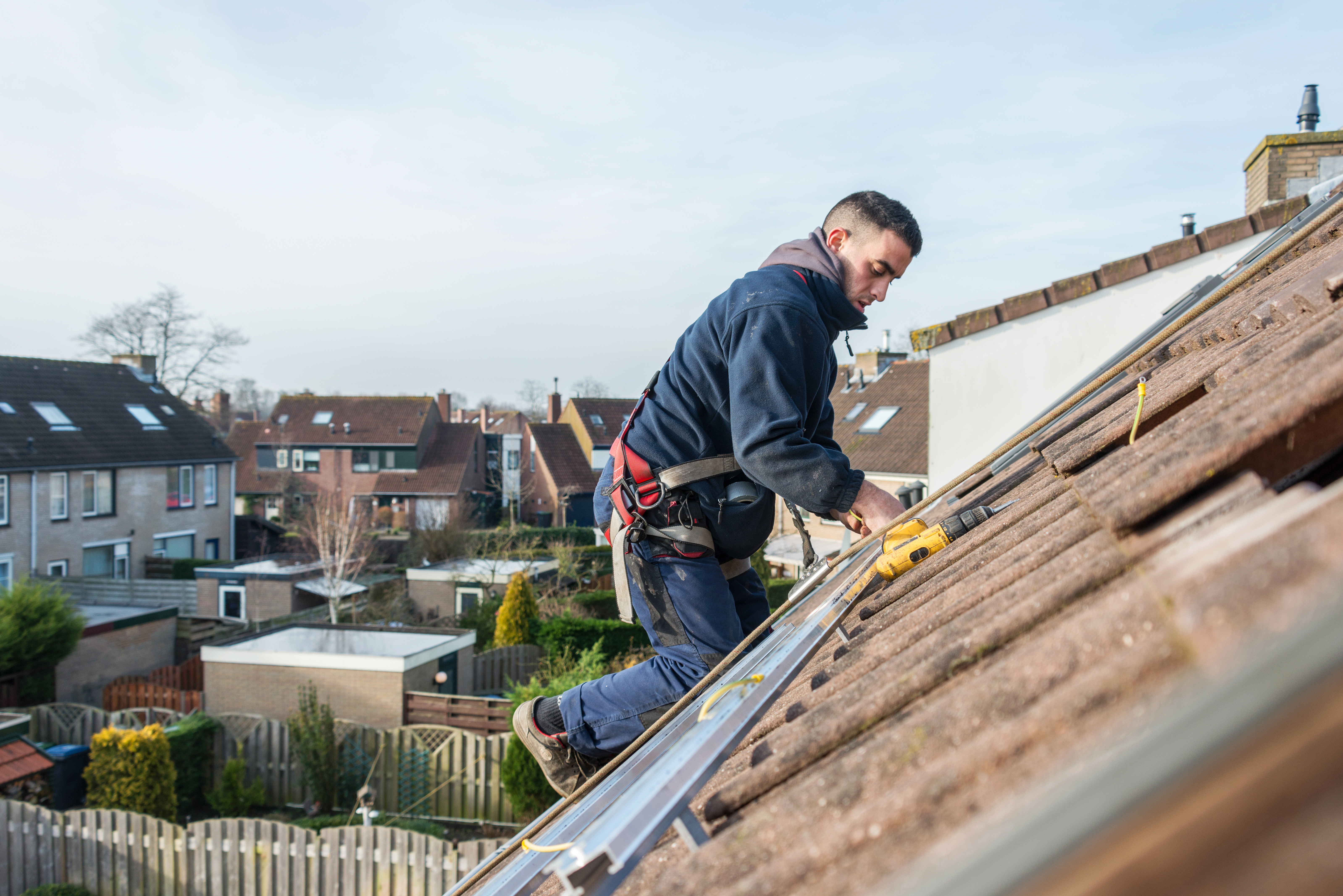 man making the construction for solar panels