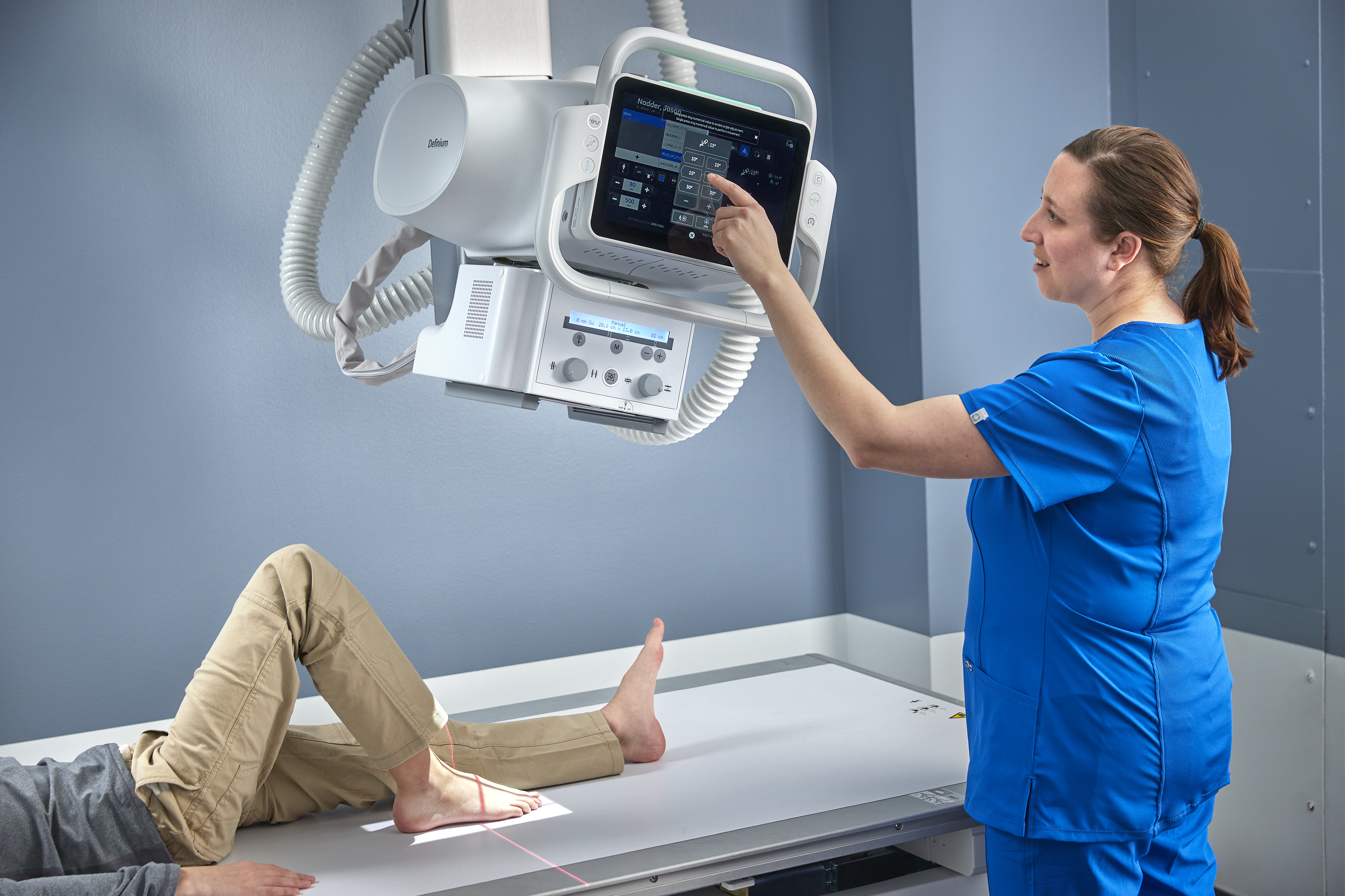 patient laying on an x-ray table getting an exam