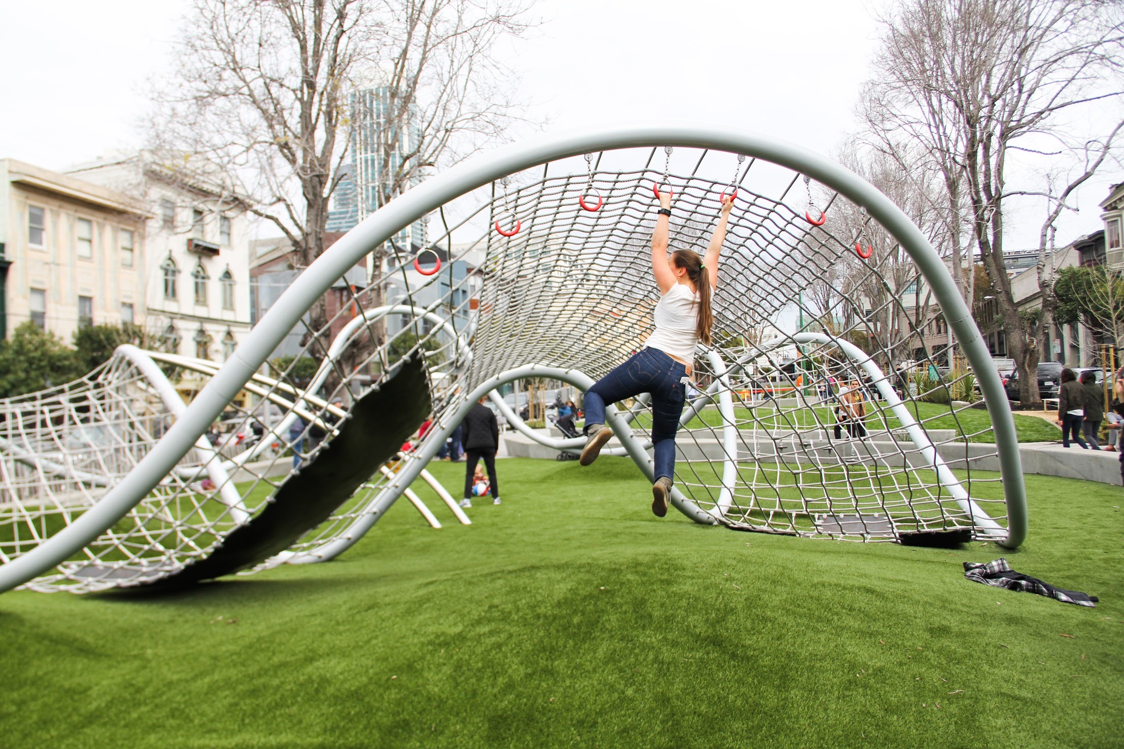 Post-South Park play structure girl swinging.JPG