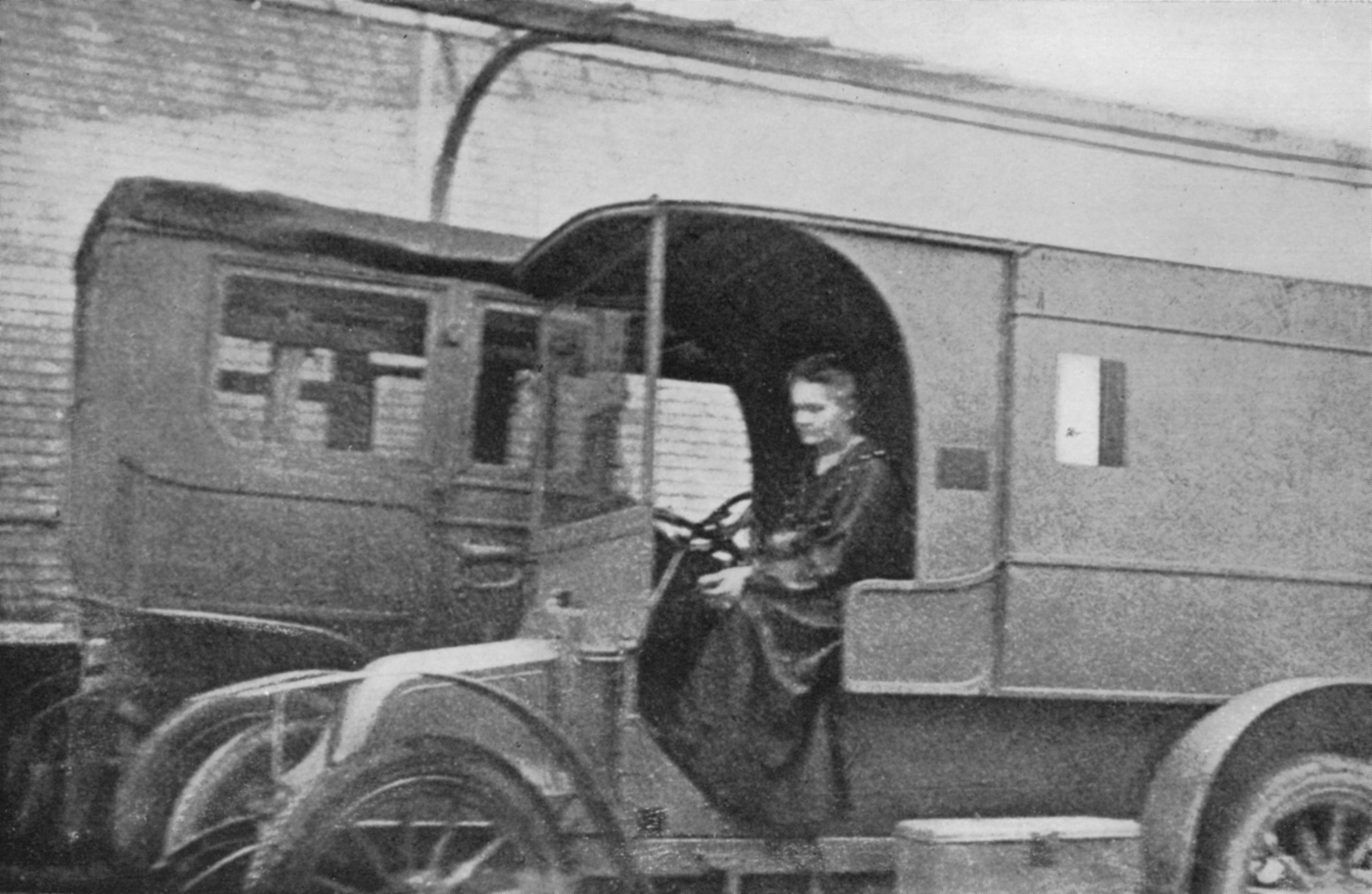 Physicist Marie Curie driving portable radiological unit