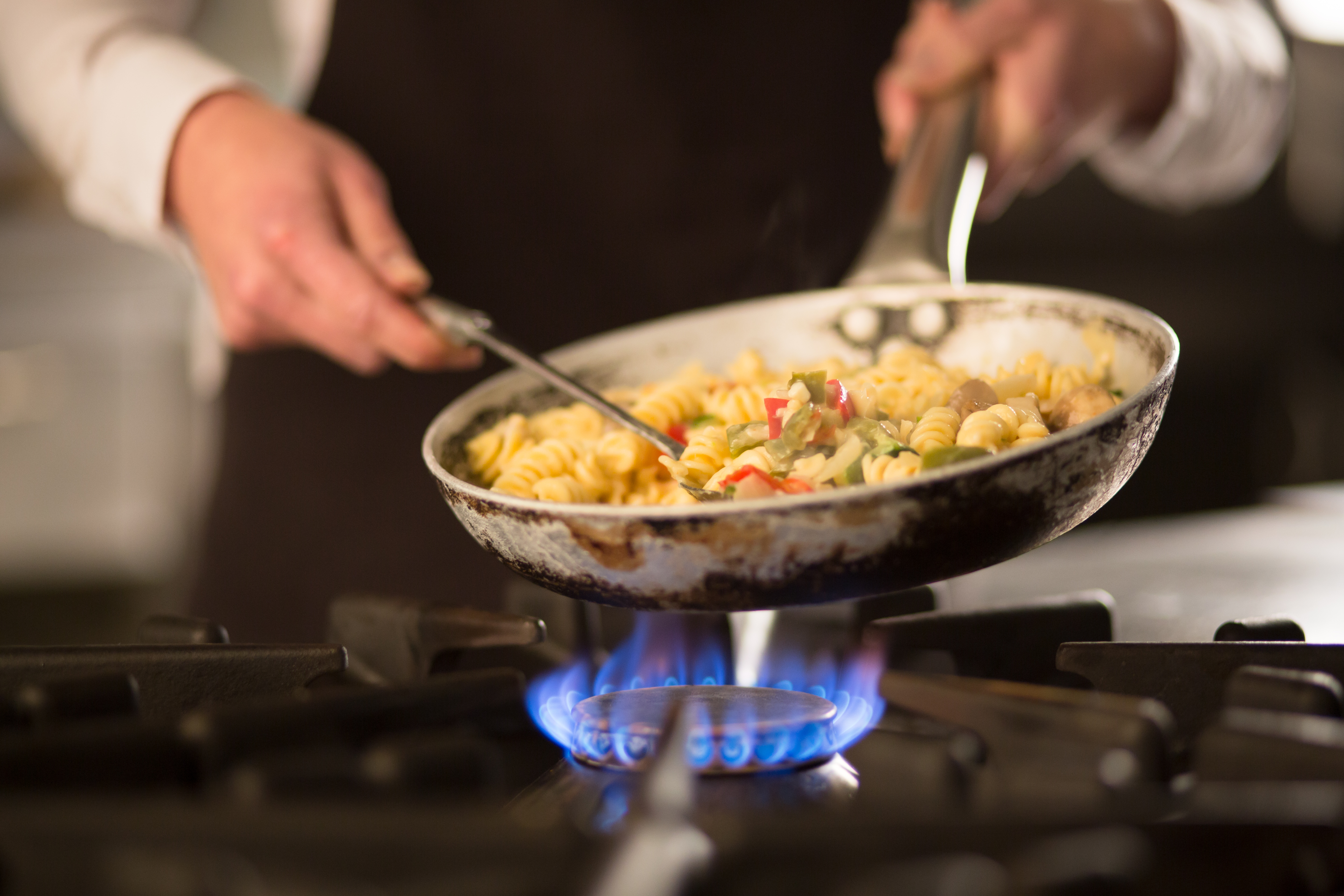 Pasta dish with vegetables on stove