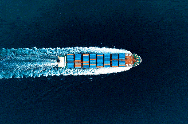 Aerial drone shot of a container ship at sea