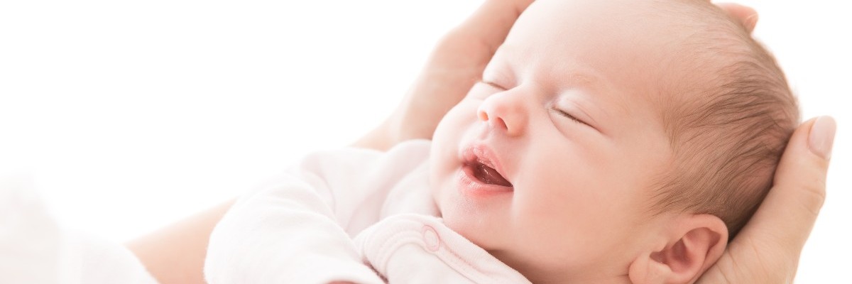 Newborn Baby Sleep on Mother Hands, New Born Girl Smiling and Sleeping, Happy Two Weeks Old Child on White