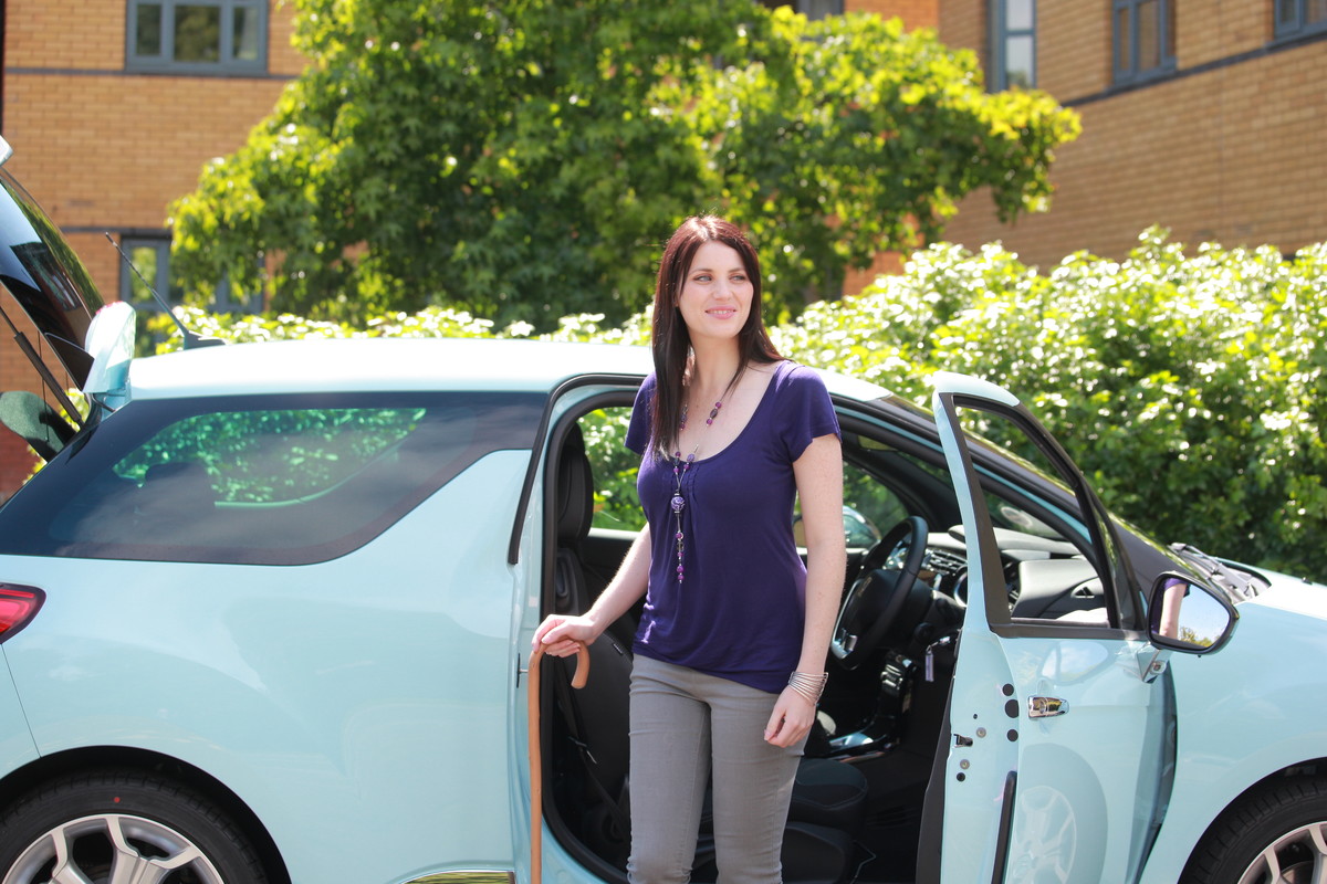 Customer by her small car