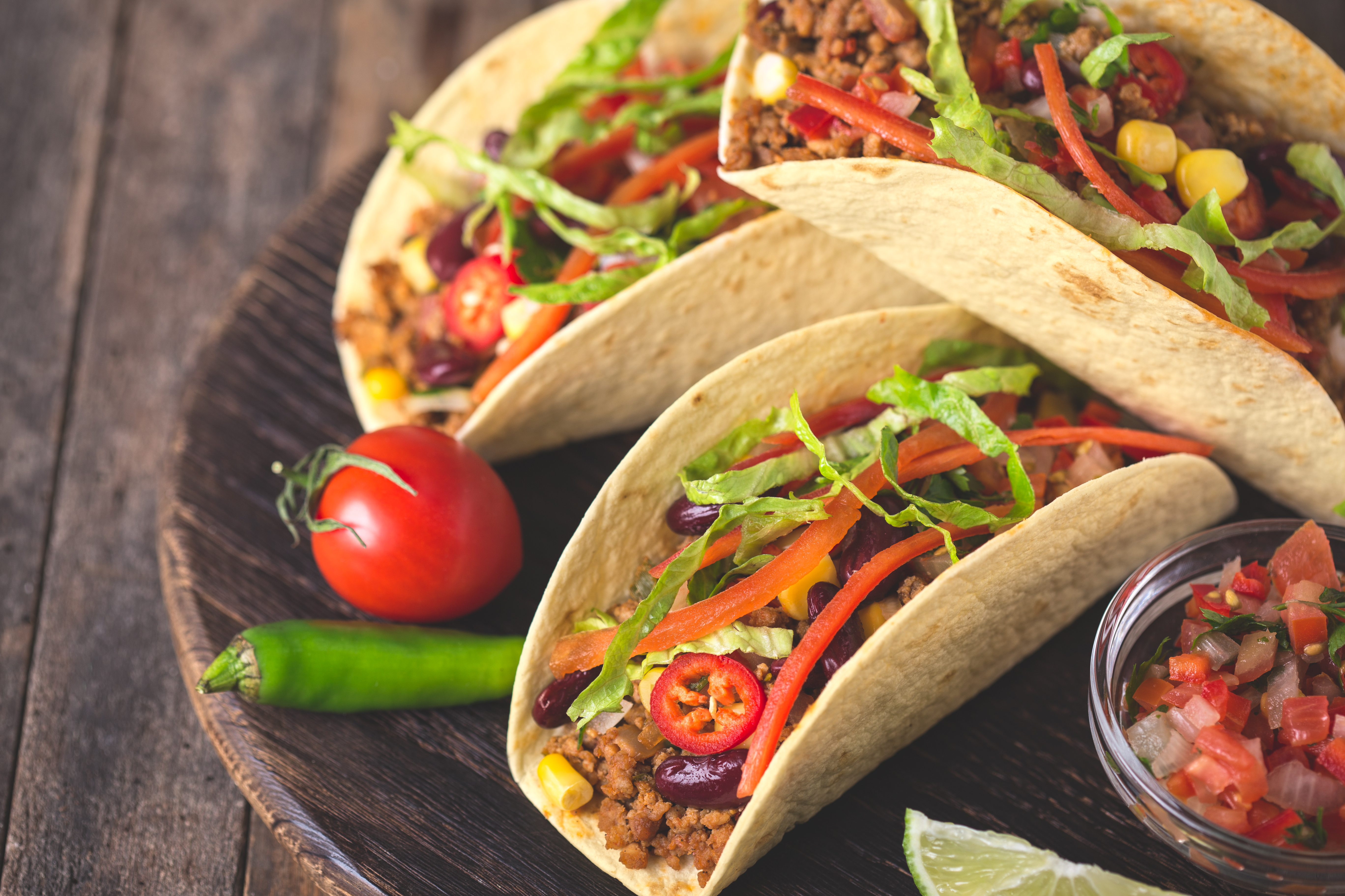 Mexican tacos with beef, vegetables and spices