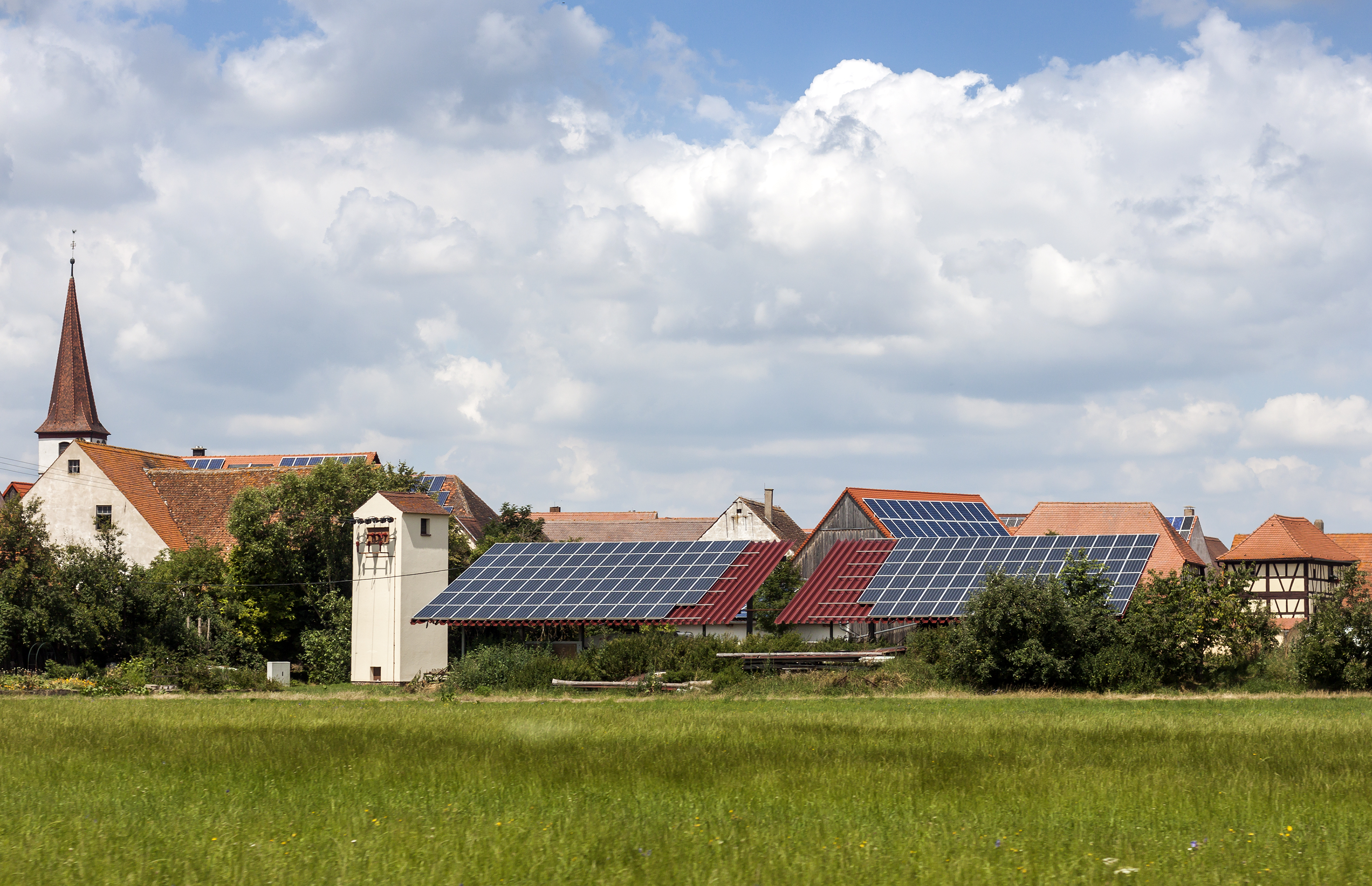 Solar powered homes in a rural village in Germany. Solar panels on roof as alternative energy source.