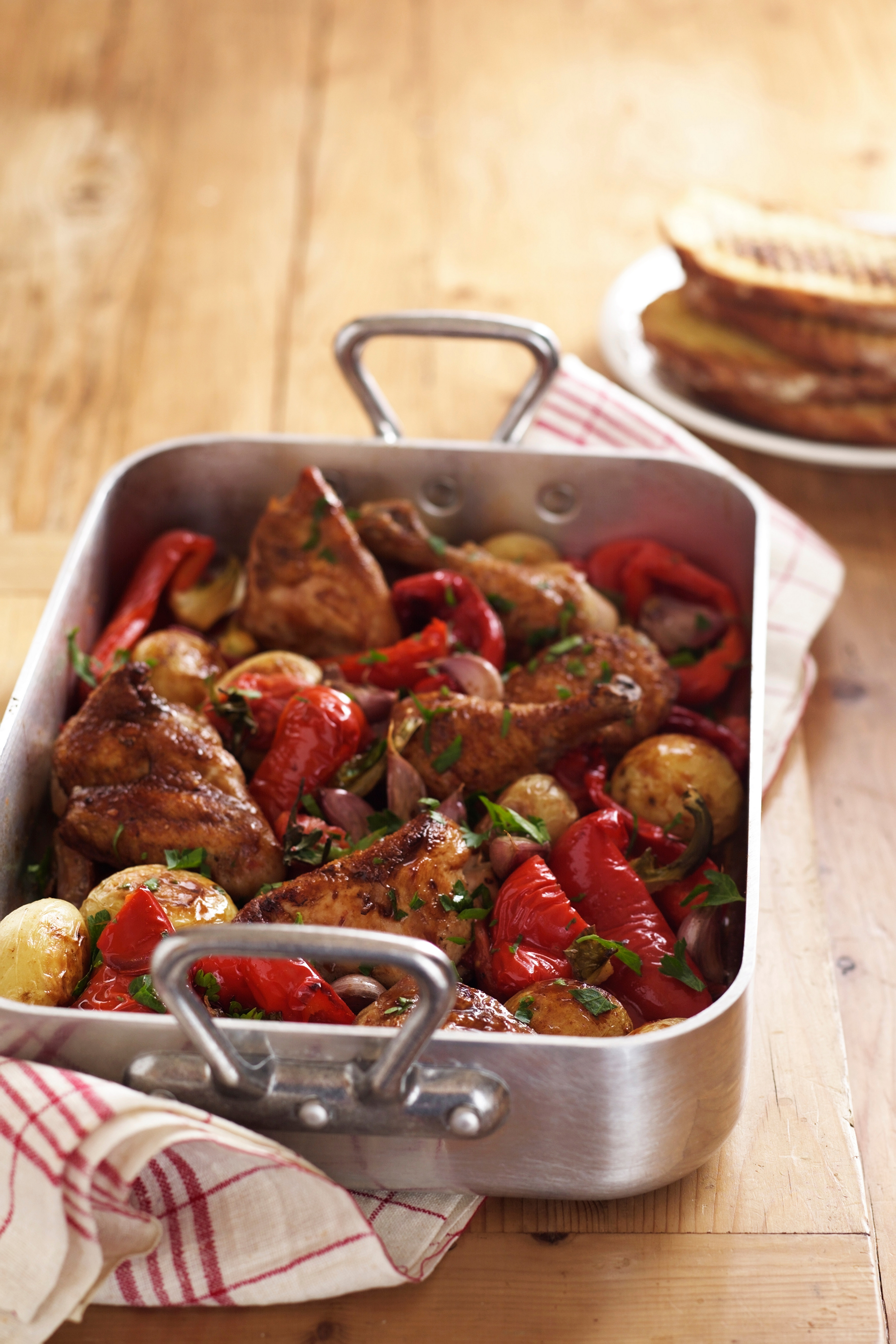 Roast chicken and vegetables in roasting tin