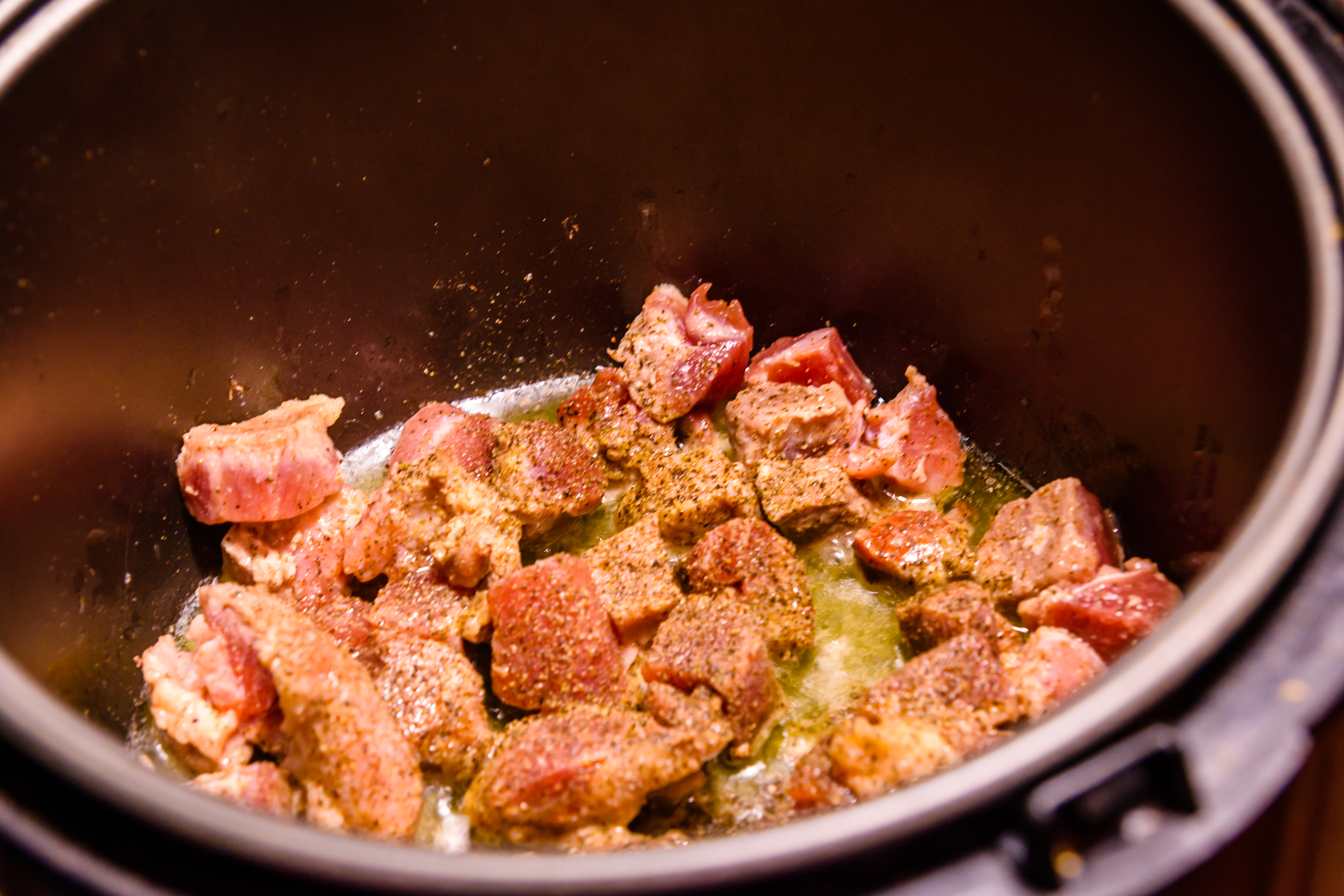 Pork meat preparing in a slow cooker