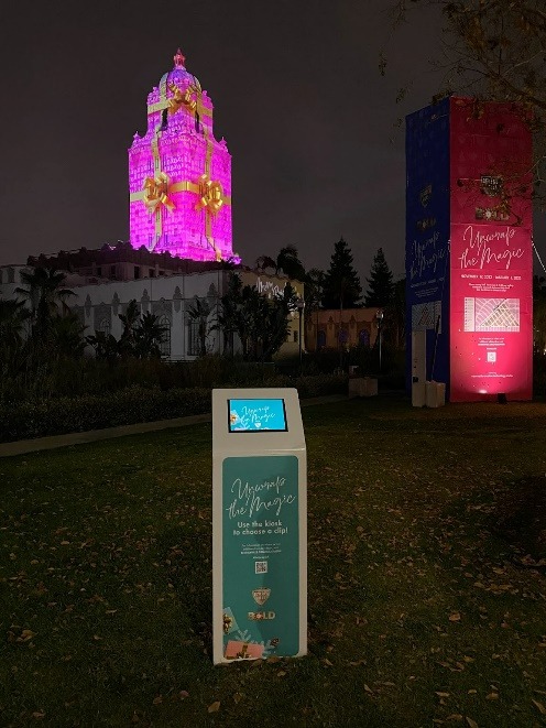 The Beverly Hills City Hall Tower is turned into a wrapped pink present with the use of large-scale projection mapping.