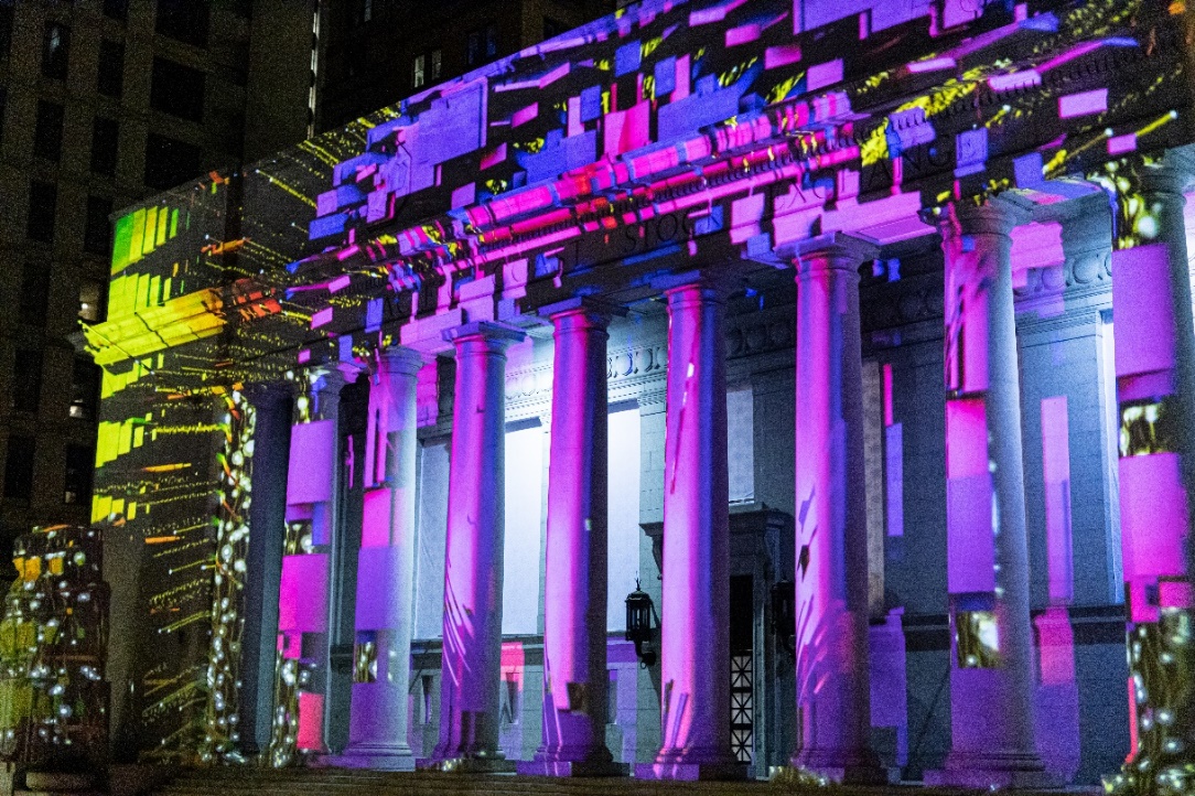 Projection mapping turns a building with columns into an immersive visual display.