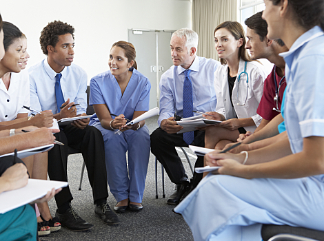 A group of physicians hold a meeting. 