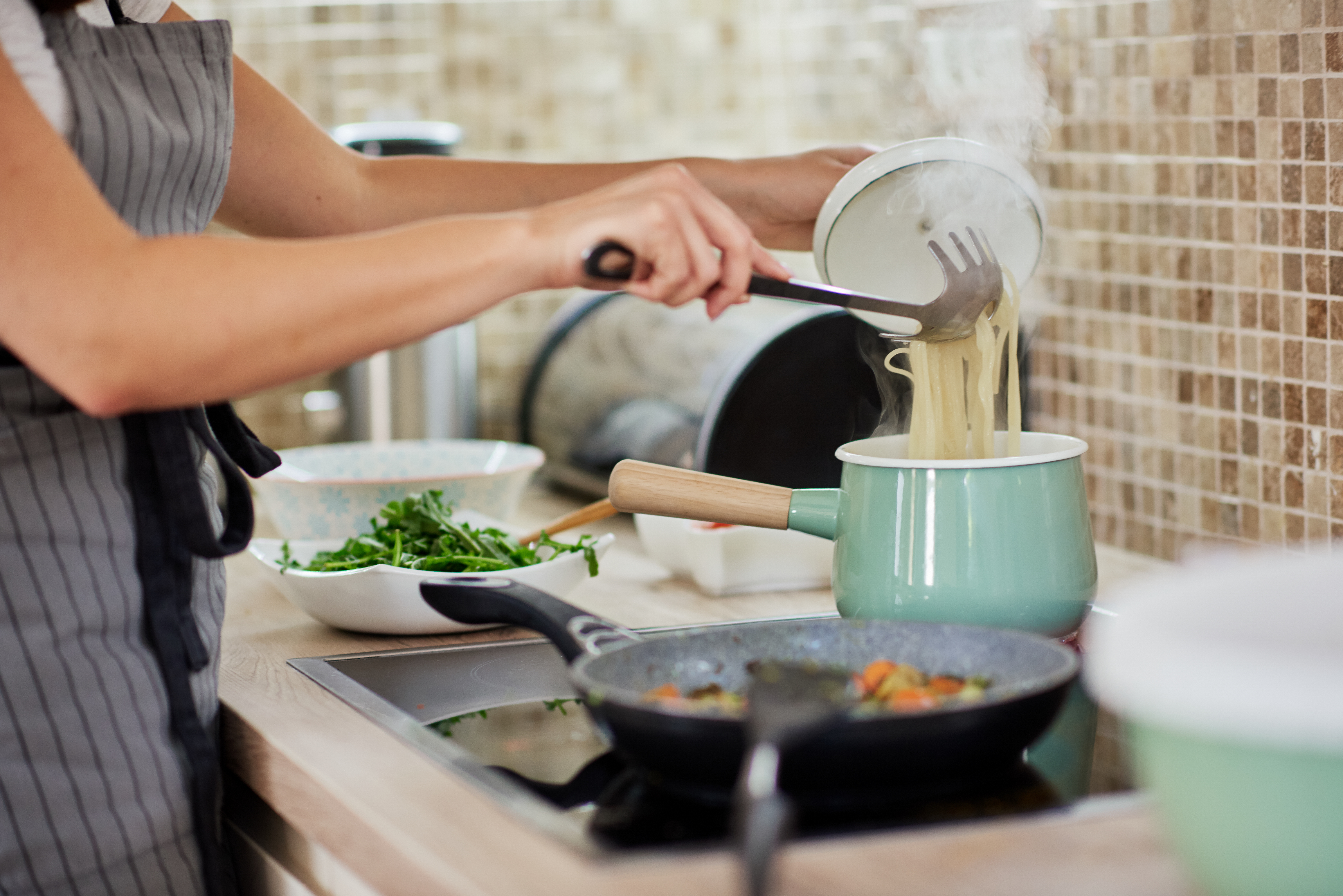 Woman preparing dinner.