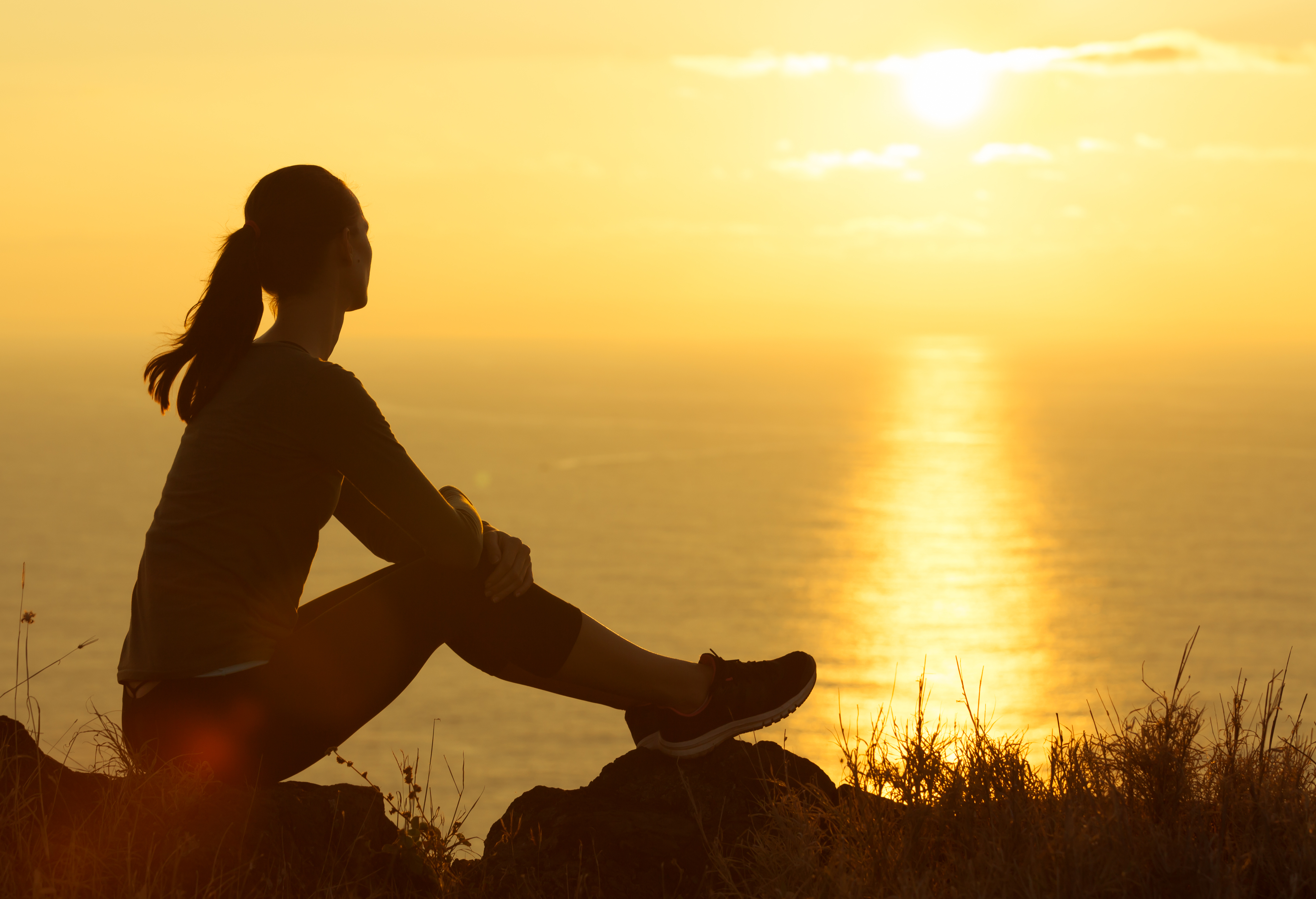 Woman watching the sunrise