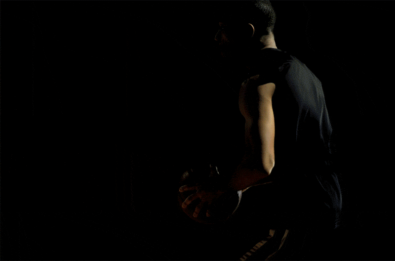 Close up shot of a man dunking a basketball