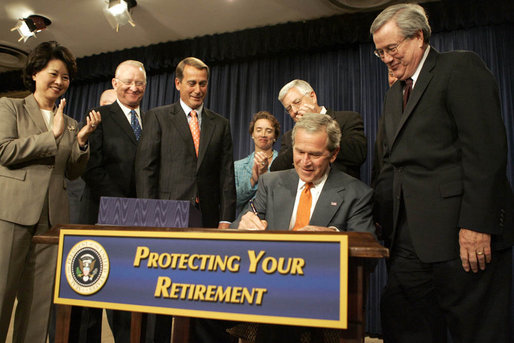 President George W. Bush signing the Pension Protection Act of 2006.