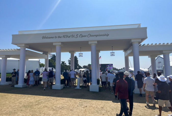 A group of people outsideDescription automatically generated with low confidence