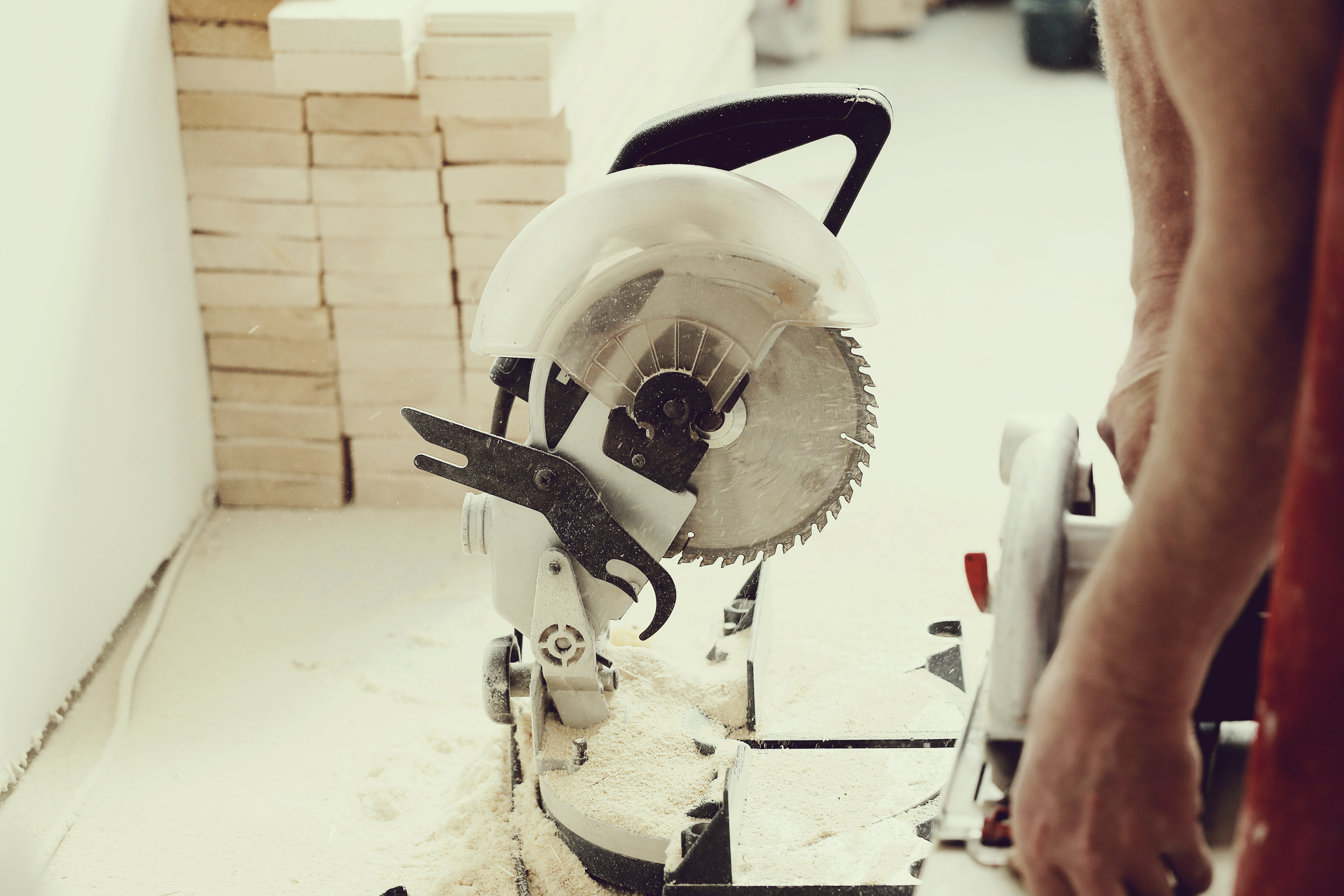 man-using-electric-saw-carpentry-shop.jpg