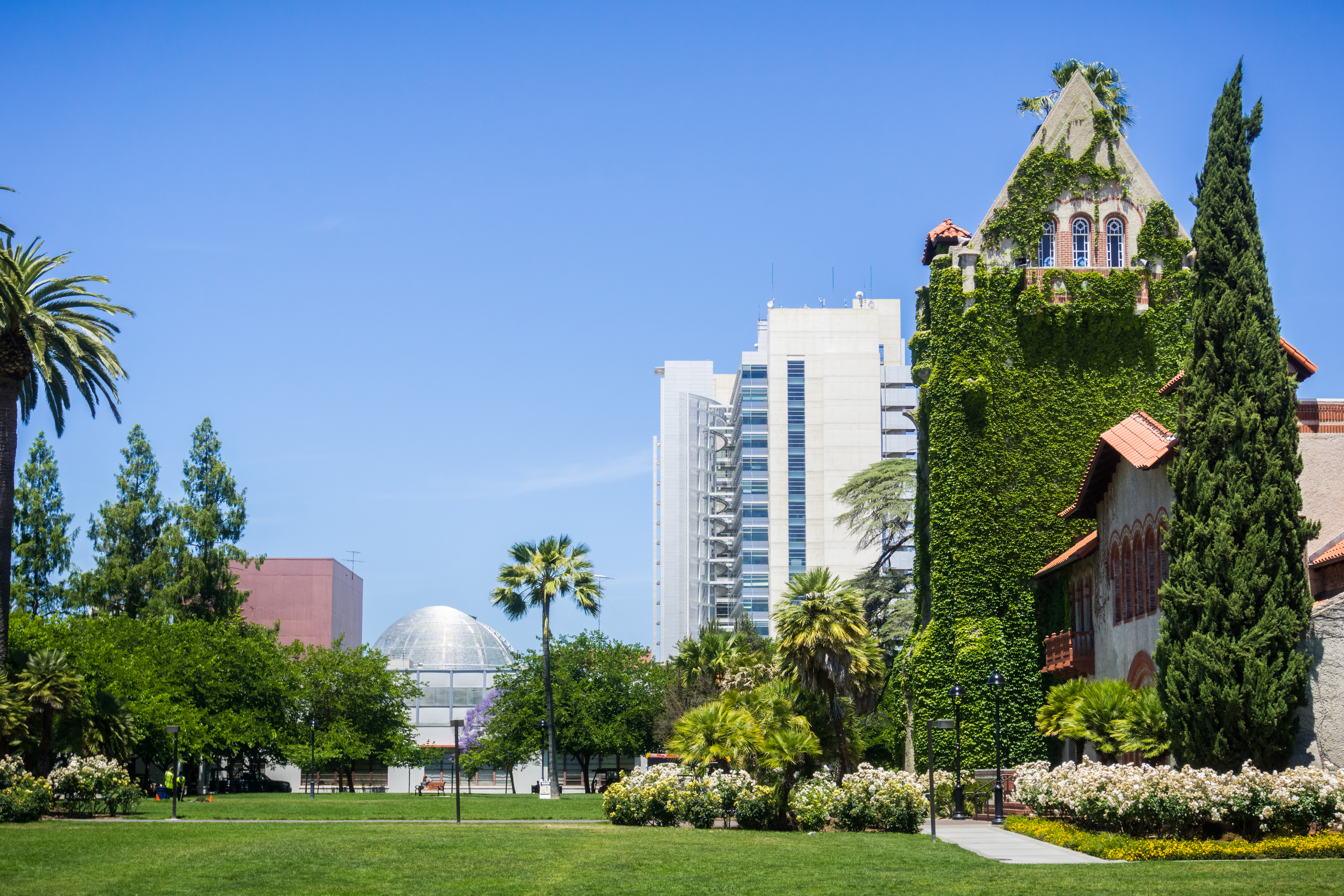 Old building at the San Jose State University; the modern City Hall building in the background; San Jose, California