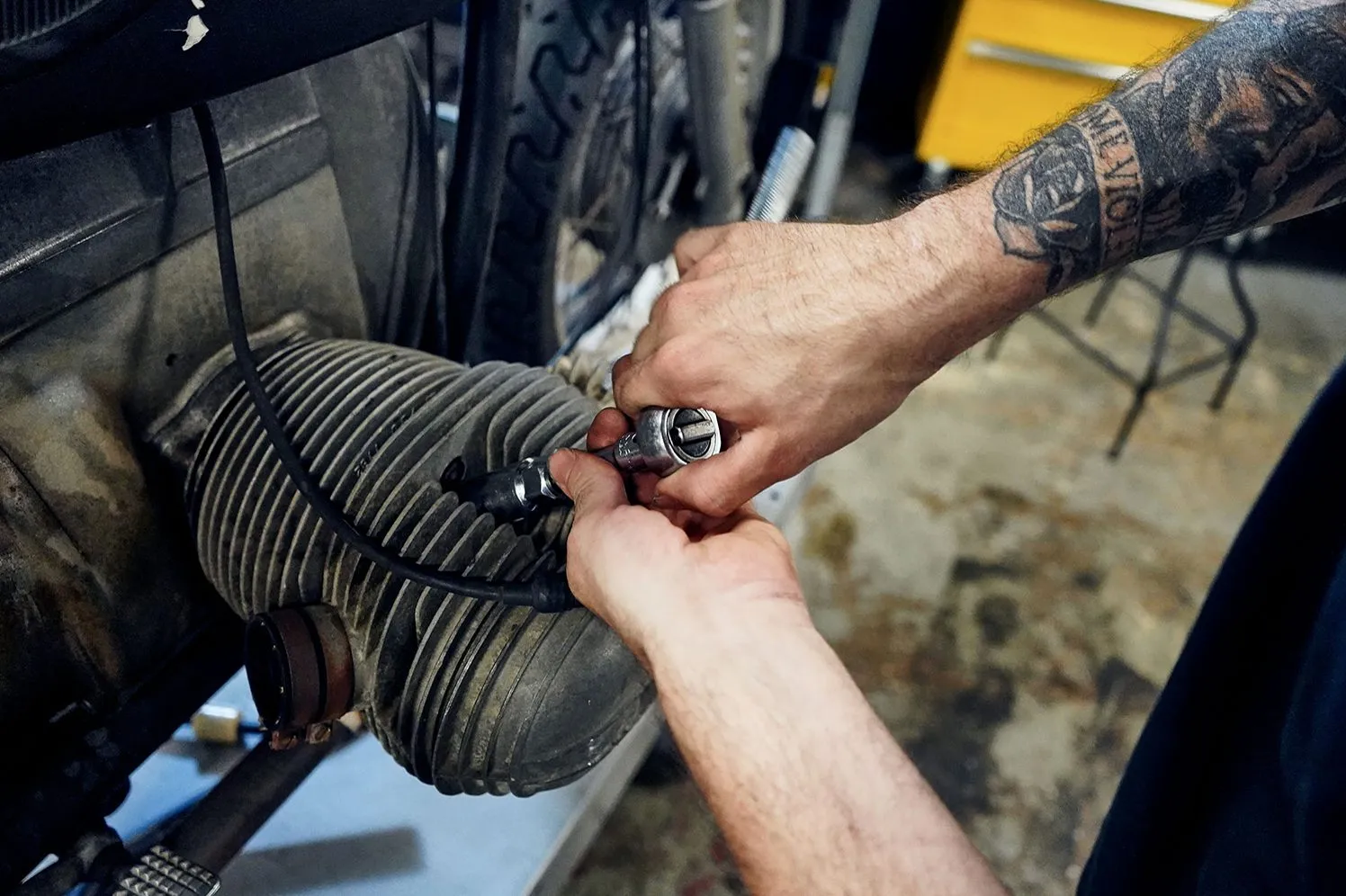 person working on motorcycle