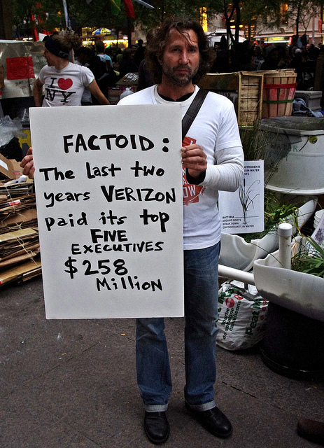 This Occupy Wall Street protester in 2011 reflects strong societal sentiment on executive compensation.