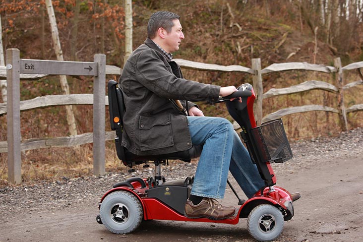 Motability Scheme customer driving scooter