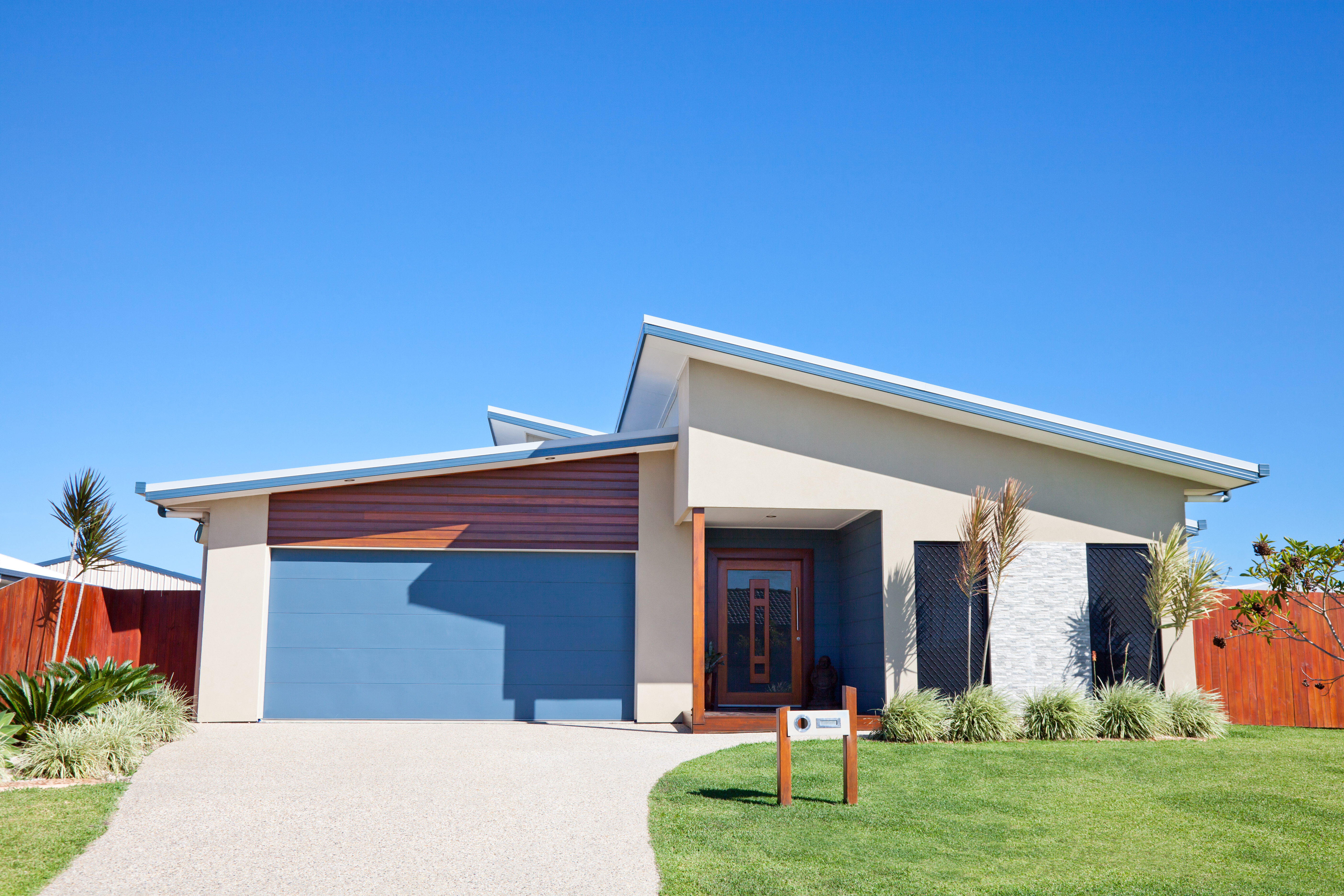 Modern Family Home Front with blue sky copyspace