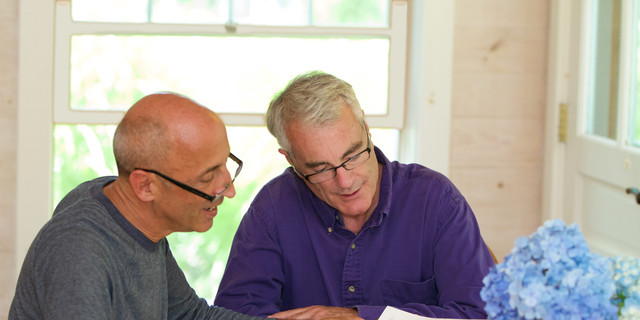 Senior Gay Male Couple Working Together on Financial Documents