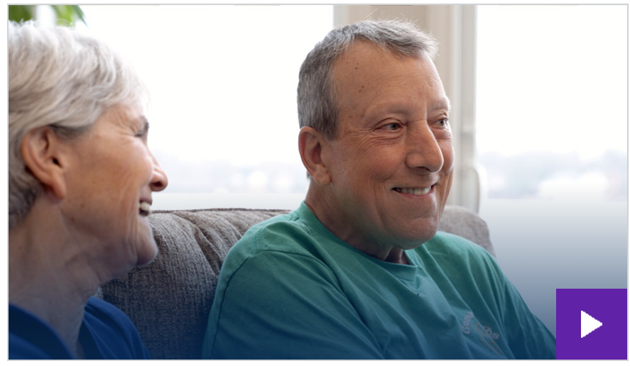 A person and person sitting on a couchDescription automatically generated with medium confidence